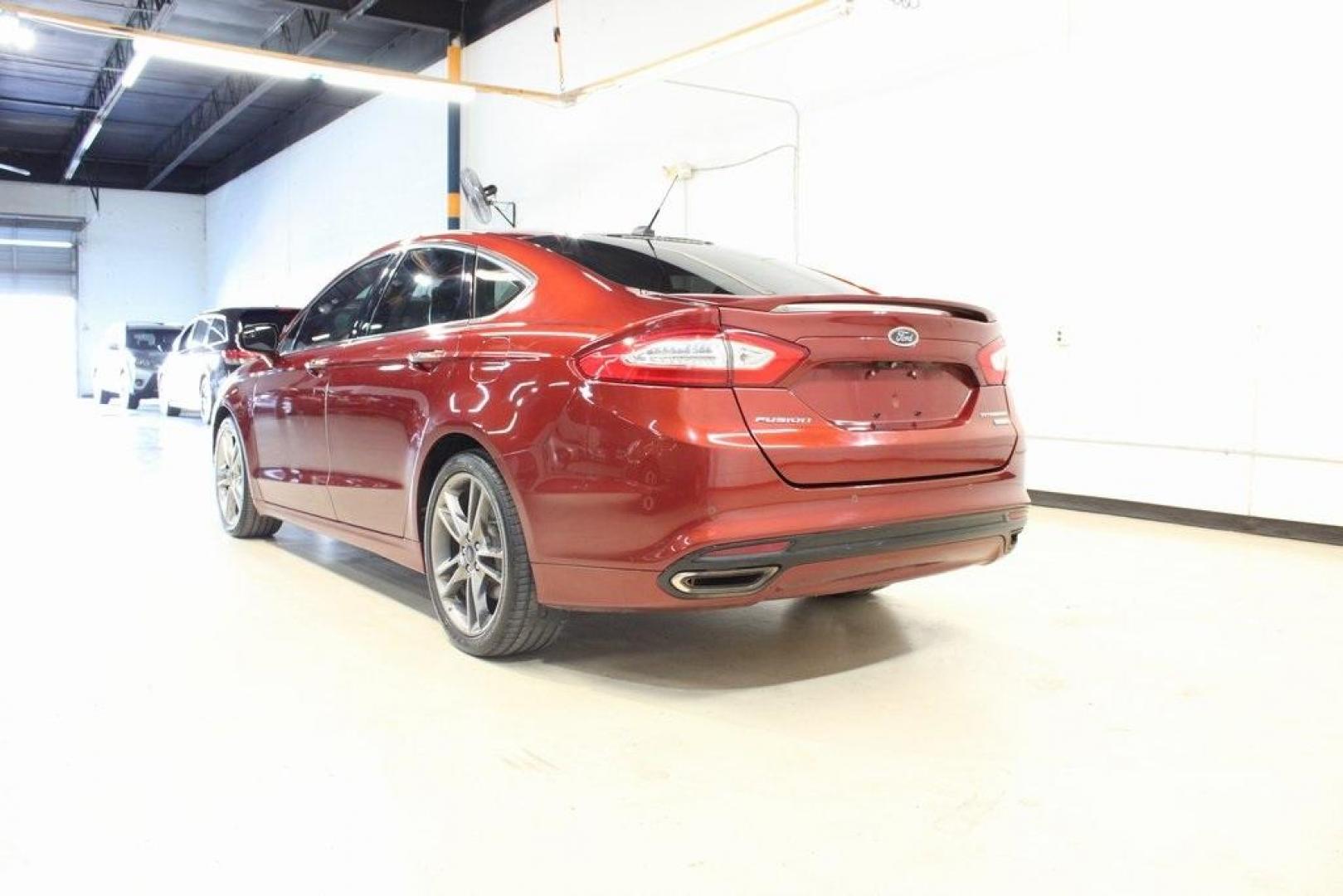 2014 Sunset Metallic /Charcoal Black Ford Fusion Titanium (3FA6P0K97ER) with an EcoBoost 2.0L I4 GTDi DOHC Turbocharged VCT engine, Automatic transmission, located at 15300 Midway Rd., Addison, TX, 75001, (972) 702-0011, 32.958321, -96.838074 - HOME OF THE NO HAGGLE PRICE - WHOLESALE PRICES TO THE PUBLIC!! Fusion Titanium, 4D Sedan, EcoBoost 2.0L I4 GTDi DOHC Turbocharged VCT, 6-Speed Automatic, FWD, Orange, Leather.<br><br>Orange 2014 Ford Fusion Titanium<br><br>22/33 City/Highway MPG<br><br>Awards:<br> * 2014 IIHS Top Safety Pick+ * 2 - Photo#2