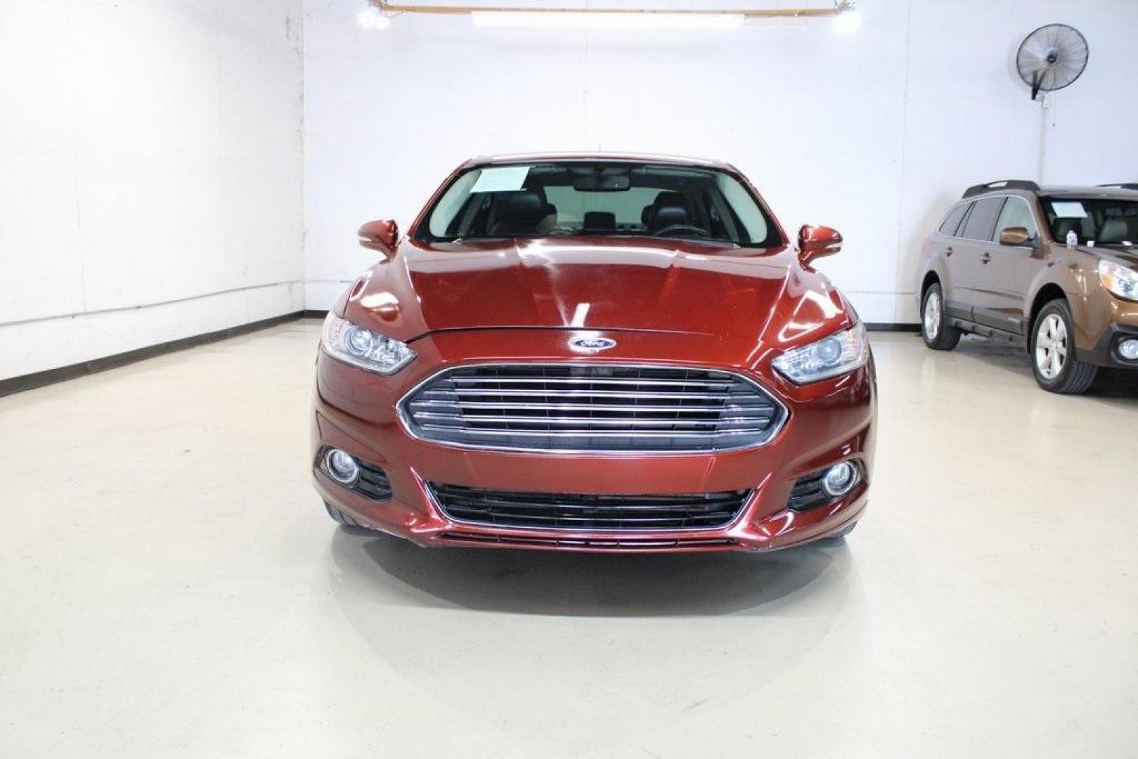 2014 Sunset Metallic /Charcoal Black Ford Fusion Titanium (3FA6P0K97ER) with an EcoBoost 2.0L I4 GTDi DOHC Turbocharged VCT engine, Automatic transmission, located at 15300 Midway Rd., Addison, TX, 75001, (972) 702-0011, 32.958321, -96.838074 - HOME OF THE NO HAGGLE PRICE - WHOLESALE PRICES TO THE PUBLIC!! Fusion Titanium, 4D Sedan, EcoBoost 2.0L I4 GTDi DOHC Turbocharged VCT, 6-Speed Automatic, FWD, Orange, Leather.<br><br>Orange 2014 Ford Fusion Titanium<br><br>22/33 City/Highway MPG<br><br>Awards:<br> * 2014 IIHS Top Safety Pick+ * 2 - Photo#4