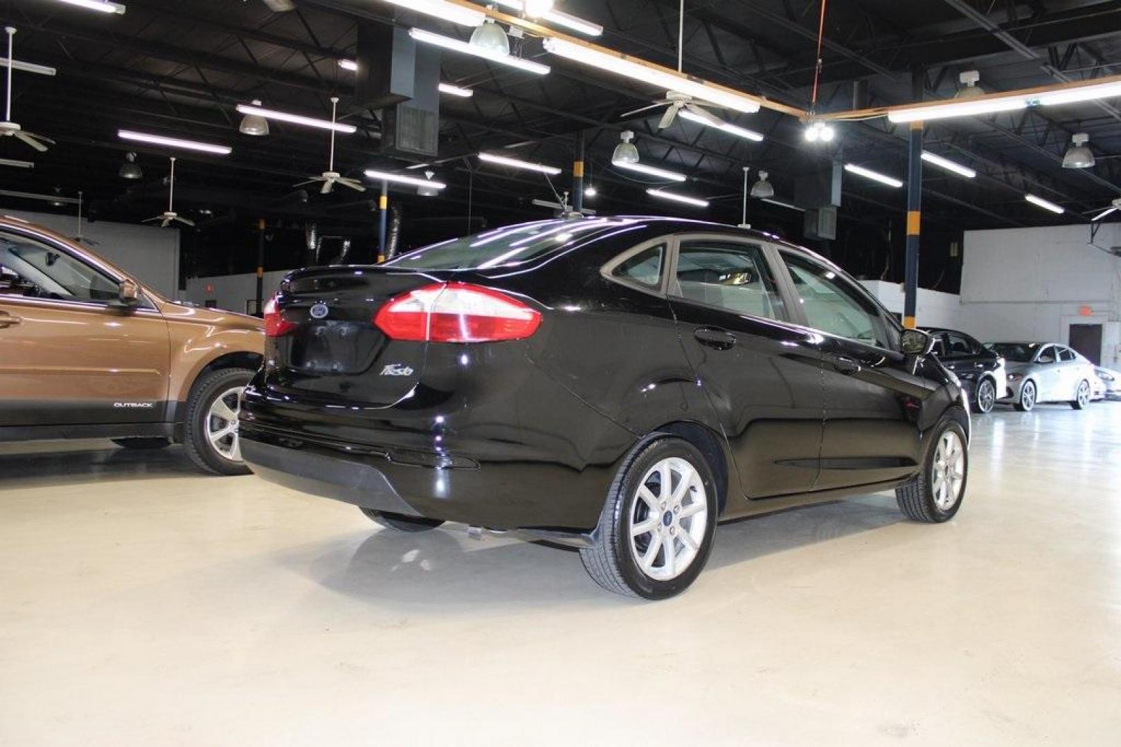 2019 Shadow Black /Charcoal Black Ford Fiesta SE (3FADP4BJ9KM) with an 1.6L I4 Ti-VCT engine, Automatic transmission, located at 15300 Midway Rd., Addison, TX, 75001, (972) 702-0011, 32.958321, -96.838074 - Photo#2