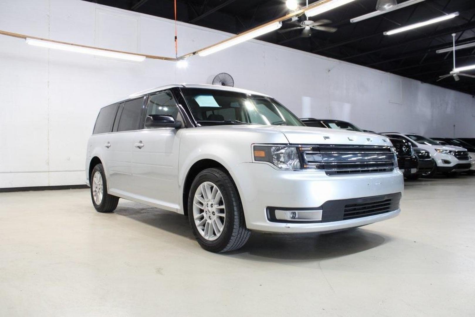 2013 Ingot Silver Metallic /Charcoal Black Ford Flex SEL (2FMGK5C83DB) with an 3.5L V6 Ti-VCT engine, Automatic transmission, located at 15300 Midway Rd., Addison, TX, 75001, (972) 702-0011, 32.958321, -96.838074 - HOME OF THE NO HAGGLE PRICE - WHOLESALE PRICES TO THE PUBLIC!! Flex SEL, 4D Sport Utility, 3.5L V6 Ti-VCT, 6-Speed Automatic with Select-Shift, FWD, Silver, Charcoal Black Cloth.<br><br>Silver 2013 Ford Flex SEL<br><br><br>Awards:<br> * 2013 IIHS Top Safety Pick * 2013 KBB.com Brand Image Awards< - Photo#1