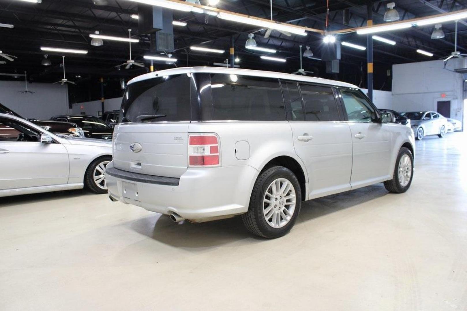 2013 Ingot Silver Metallic /Charcoal Black Ford Flex SEL (2FMGK5C83DB) with an 3.5L V6 Ti-VCT engine, Automatic transmission, located at 15300 Midway Rd., Addison, TX, 75001, (972) 702-0011, 32.958321, -96.838074 - HOME OF THE NO HAGGLE PRICE - WHOLESALE PRICES TO THE PUBLIC!! Flex SEL, 4D Sport Utility, 3.5L V6 Ti-VCT, 6-Speed Automatic with Select-Shift, FWD, Silver, Charcoal Black Cloth.<br><br>Silver 2013 Ford Flex SEL<br><br><br>Awards:<br> * 2013 IIHS Top Safety Pick * 2013 KBB.com Brand Image Awards< - Photo#2