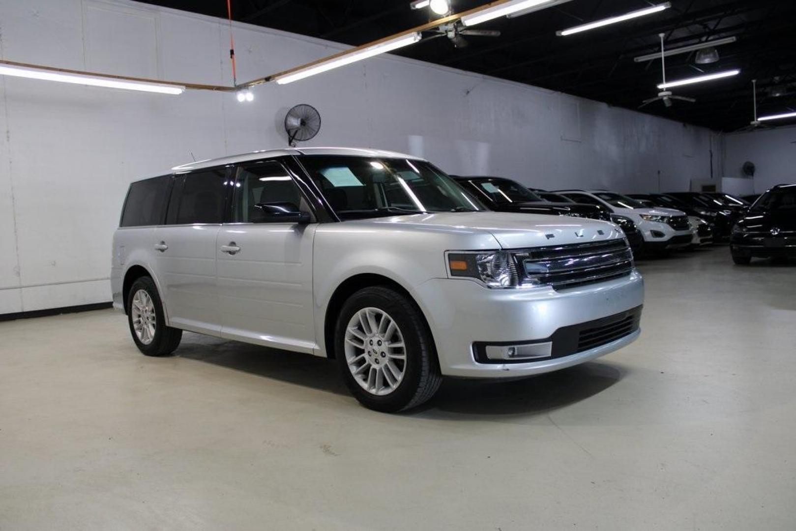 2013 Ingot Silver Metallic /Charcoal Black Ford Flex SEL (2FMGK5C83DB) with an 3.5L V6 Ti-VCT engine, Automatic transmission, located at 15300 Midway Rd., Addison, TX, 75001, (972) 702-0011, 32.958321, -96.838074 - HOME OF THE NO HAGGLE PRICE - WHOLESALE PRICES TO THE PUBLIC!! Flex SEL, 4D Sport Utility, 3.5L V6 Ti-VCT, 6-Speed Automatic with Select-Shift, FWD, Silver, Charcoal Black Cloth.<br><br>Silver 2013 Ford Flex SEL<br><br><br>Awards:<br> * 2013 IIHS Top Safety Pick * 2013 KBB.com Brand Image Awards< - Photo#6