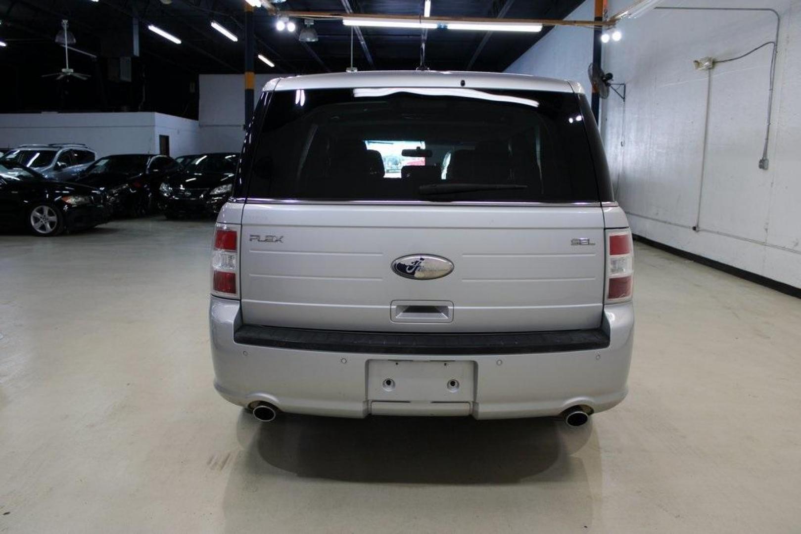 2013 Ingot Silver Metallic /Charcoal Black Ford Flex SEL (2FMGK5C83DB) with an 3.5L V6 Ti-VCT engine, Automatic transmission, located at 15300 Midway Rd., Addison, TX, 75001, (972) 702-0011, 32.958321, -96.838074 - HOME OF THE NO HAGGLE PRICE - WHOLESALE PRICES TO THE PUBLIC!! Flex SEL, 4D Sport Utility, 3.5L V6 Ti-VCT, 6-Speed Automatic with Select-Shift, FWD, Silver, Charcoal Black Cloth.<br><br>Silver 2013 Ford Flex SEL<br><br><br>Awards:<br> * 2013 IIHS Top Safety Pick * 2013 KBB.com Brand Image Awards< - Photo#7