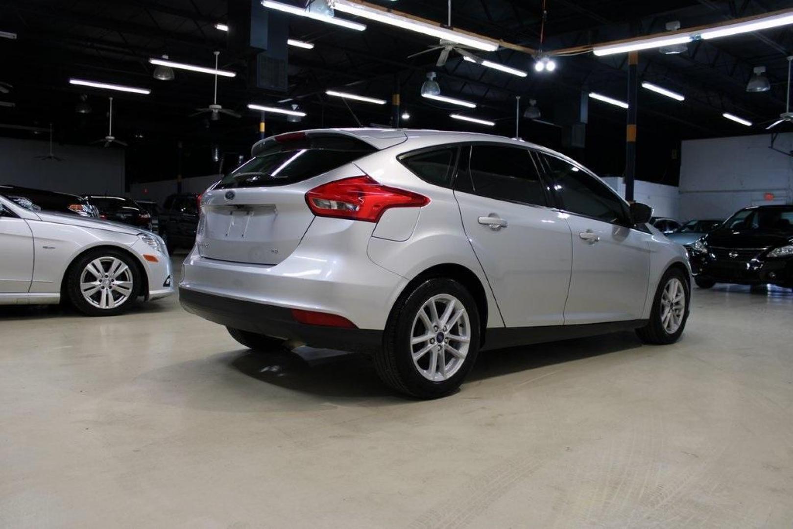 2018 Ingot Silver /Charcoal Black Ford Focus SE (1FADP3K24JL) with an 2.0L I4 DGI Ti-VCT engine, Automatic transmission, located at 15300 Midway Rd., Addison, TX, 75001, (972) 702-0011, 32.958321, -96.838074 - Photo#2