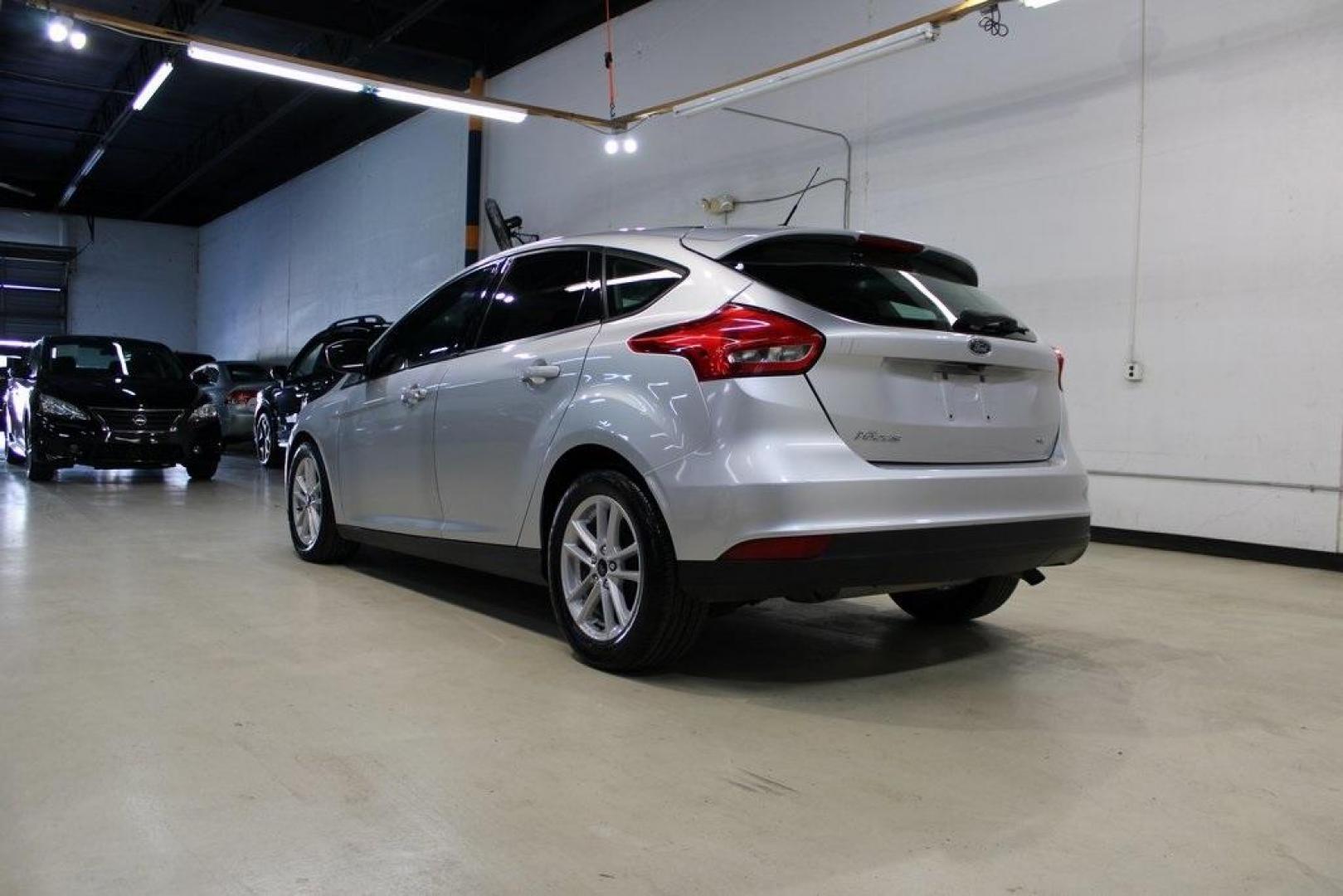 2018 Ingot Silver /Charcoal Black Ford Focus SE (1FADP3K24JL) with an 2.0L I4 DGI Ti-VCT engine, Automatic transmission, located at 15300 Midway Rd., Addison, TX, 75001, (972) 702-0011, 32.958321, -96.838074 - Photo#3