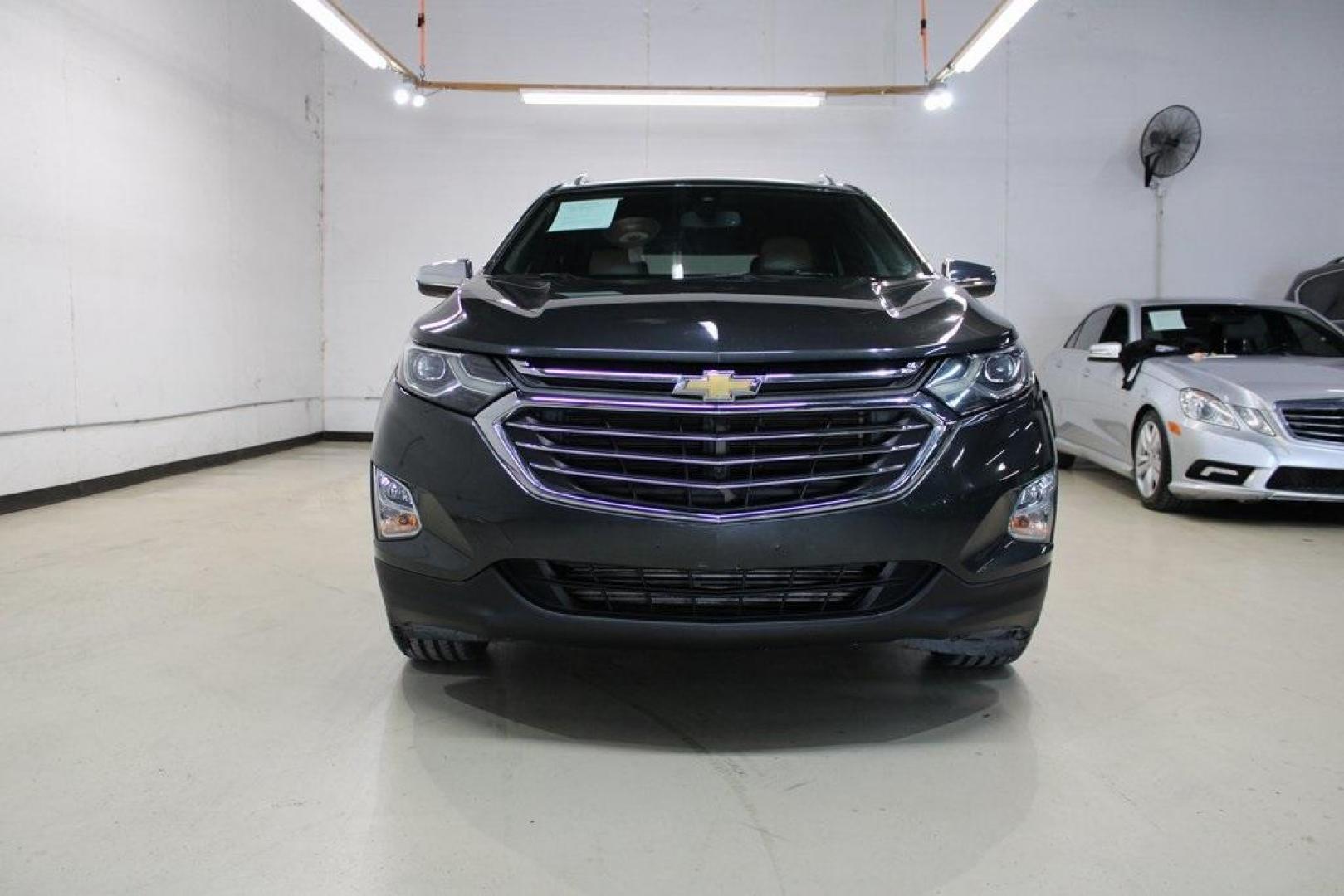 2018 Nightfall Gray Metallic /Jet Black/Brandy Chevrolet Equinox Premier (2GNAXMEV0J6) with an 1.5L DOHC engine, Automatic transmission, located at 15300 Midway Rd., Addison, TX, 75001, (972) 702-0011, 32.958321, -96.838074 - HOME OF THE NO HAGGLE PRICE - WHOLESALE PRICES TO THE PUBLIC!! Equinox Premier, 4D Sport Utility, 1.5L DOHC, 6-Speed Automatic Electronic with Overdrive, FWD, Nightfall Gray Metallic, Jet Black/Brandy Leather.<br><br>Nightfall Gray Metallic 2018 Chevrolet Equinox Premier<br><br>26/32 City/Highway MP - Photo#5