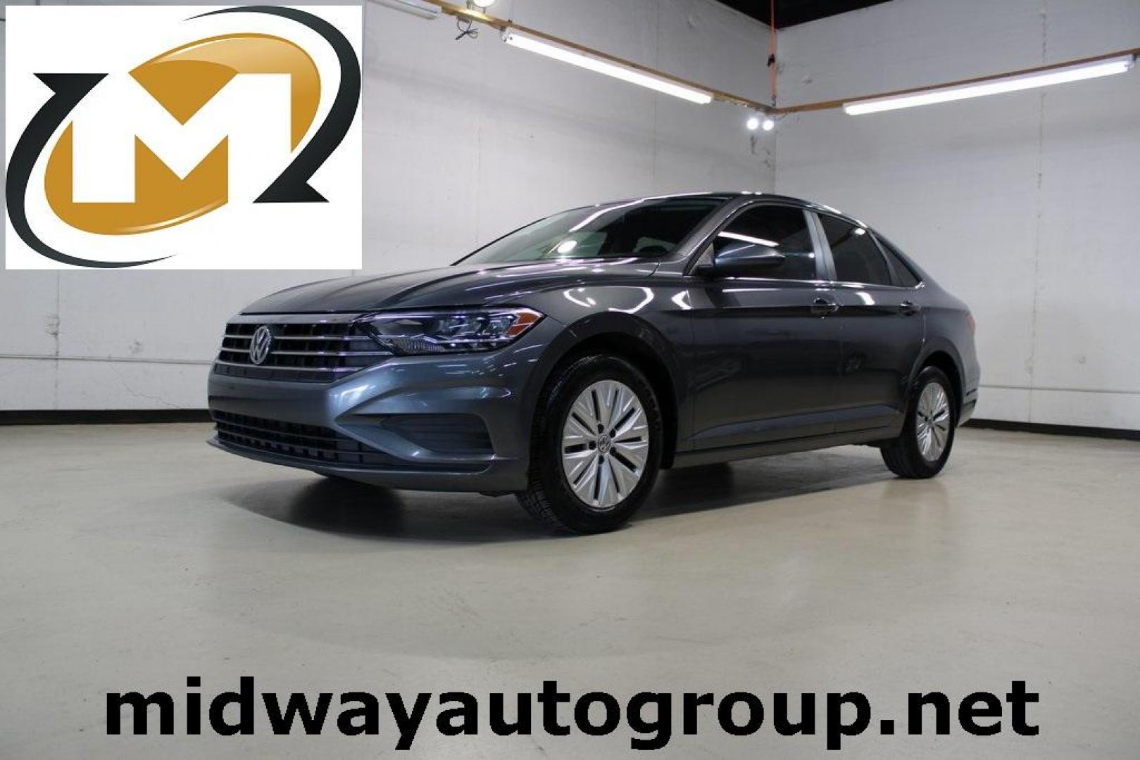 2019 Platinum Gray Metallic /Storm Gray Volkswagen Jetta 1.4T S (3VWC57BU4KM) with an 1.4L TSI engine, Automatic transmission, located at 15300 Midway Rd., Addison, TX, 75001, (972) 702-0011, 32.958321, -96.838074 - HOME OF THE NO HAGGLE PRICE - WHOLESALE PRICES TO THE PUBLIC!! non smoker, Jetta 1.4T S, 4D Sedan, 1.4L TSI, 8-Speed Automatic with Tiptronic, FWD, Gray.<br><br>Gray 2019 Volkswagen Jetta 1.4T S<br><br>Recent Arrival! 30/40 City/Highway MPG<br><br>Awards:<br> * 2019 KBB.com 10 Best Sedans Under $30 - Photo#0