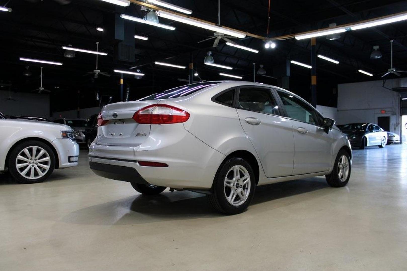 2019 Ingot Silver /Medium Light Stone Ford Fiesta SE (3FADP4BJ9KM) with an 1.6L I4 Ti-VCT engine, Automatic transmission, located at 15300 Midway Rd., Addison, TX, 75001, (972) 702-0011, 32.958321, -96.838074 - Photo#2