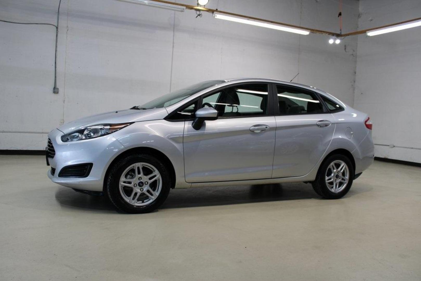 2019 Ingot Silver /Medium Light Stone Ford Fiesta SE (3FADP4BJ9KM) with an 1.6L I4 Ti-VCT engine, Automatic transmission, located at 15300 Midway Rd., Addison, TX, 75001, (972) 702-0011, 32.958321, -96.838074 - Photo#4