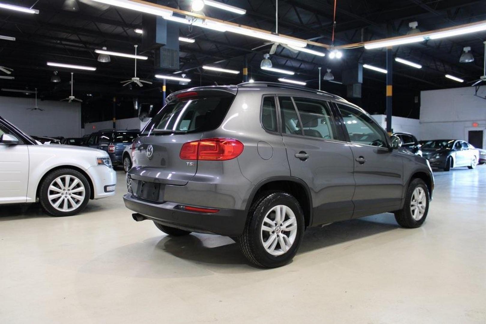 2016 Gray Volkswagen Tiguan S (WVGAV7AX2GW) with an 2.0L 4-Cylinder Turbocharged engine, Automatic transmission, located at 15300 Midway Rd., Addison, TX, 75001, (972) 702-0011, 32.958321, -96.838074 - Photo#2