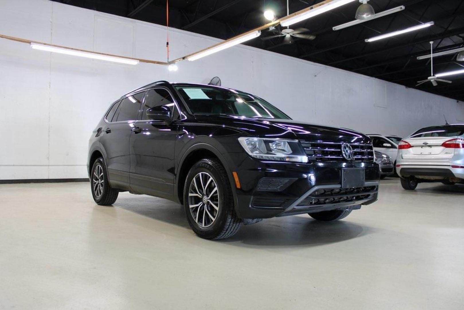 2019 Deep Black Pearl Volkswagen Tiguan 2.0T SE (3VV3B7AX0KM) with an 2.0L TSI DOHC engine, Automatic transmission, located at 15300 Midway Rd., Addison, TX, 75001, (972) 702-0011, 32.958321, -96.838074 - Photo#1