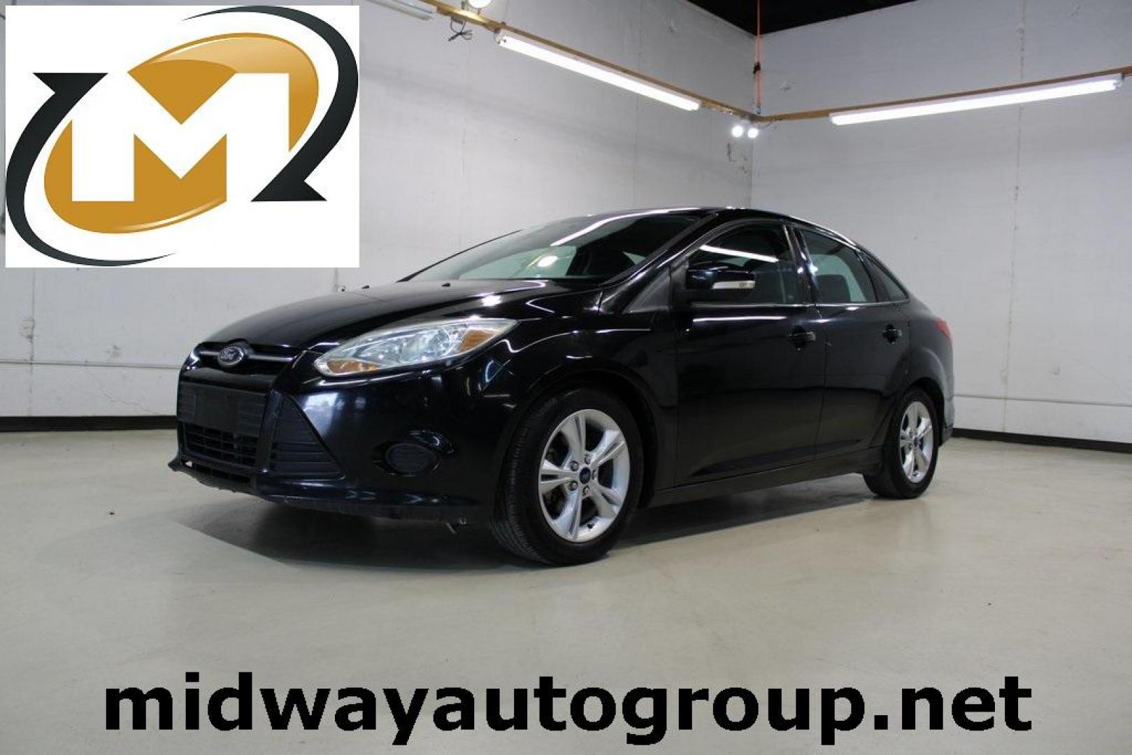 2014 Tuxedo Black Metallic Ford Focus SE (1FADP3F26EL) with an I4 engine, located at 15300 Midway Rd., Addison, TX, 75001, (972) 702-0011, 32.958321, -96.838074 - Photo#0