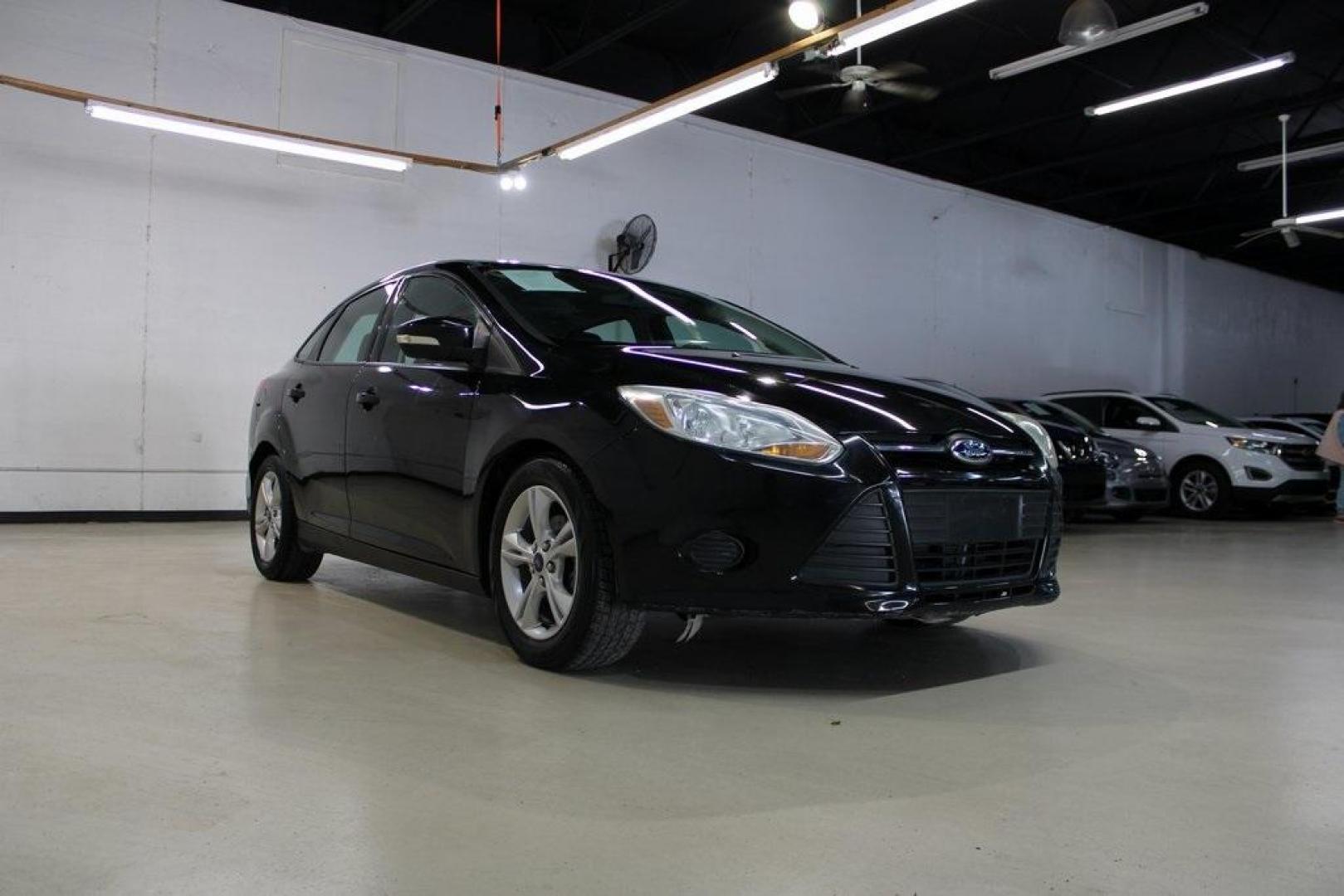 2014 Tuxedo Black Metallic Ford Focus SE (1FADP3F26EL) with an I4 engine, located at 15300 Midway Rd., Addison, TX, 75001, (972) 702-0011, 32.958321, -96.838074 - Photo#1