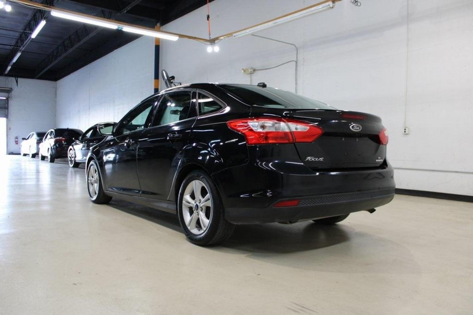 2014 Tuxedo Black Metallic Ford Focus SE (1FADP3F26EL) with an I4 engine, located at 15300 Midway Rd., Addison, TX, 75001, (972) 702-0011, 32.958321, -96.838074 - Photo#3