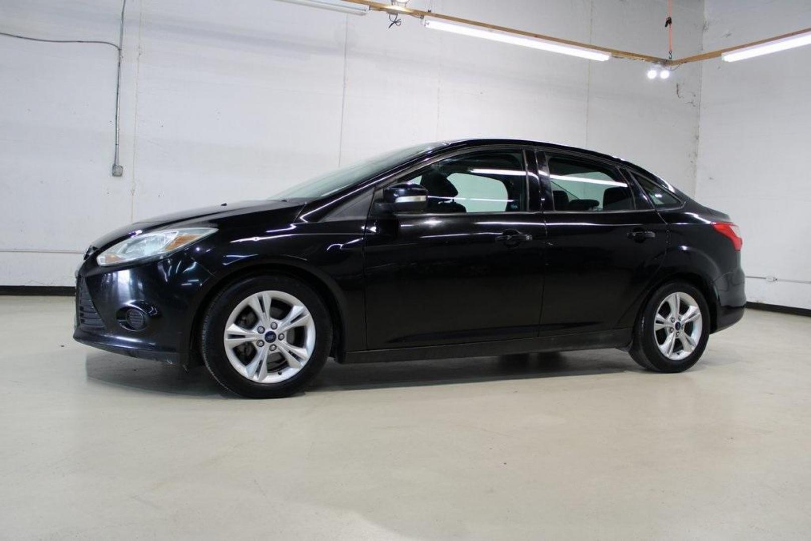 2014 Tuxedo Black Metallic Ford Focus SE (1FADP3F26EL) with an I4 engine, located at 15300 Midway Rd., Addison, TX, 75001, (972) 702-0011, 32.958321, -96.838074 - Photo#4