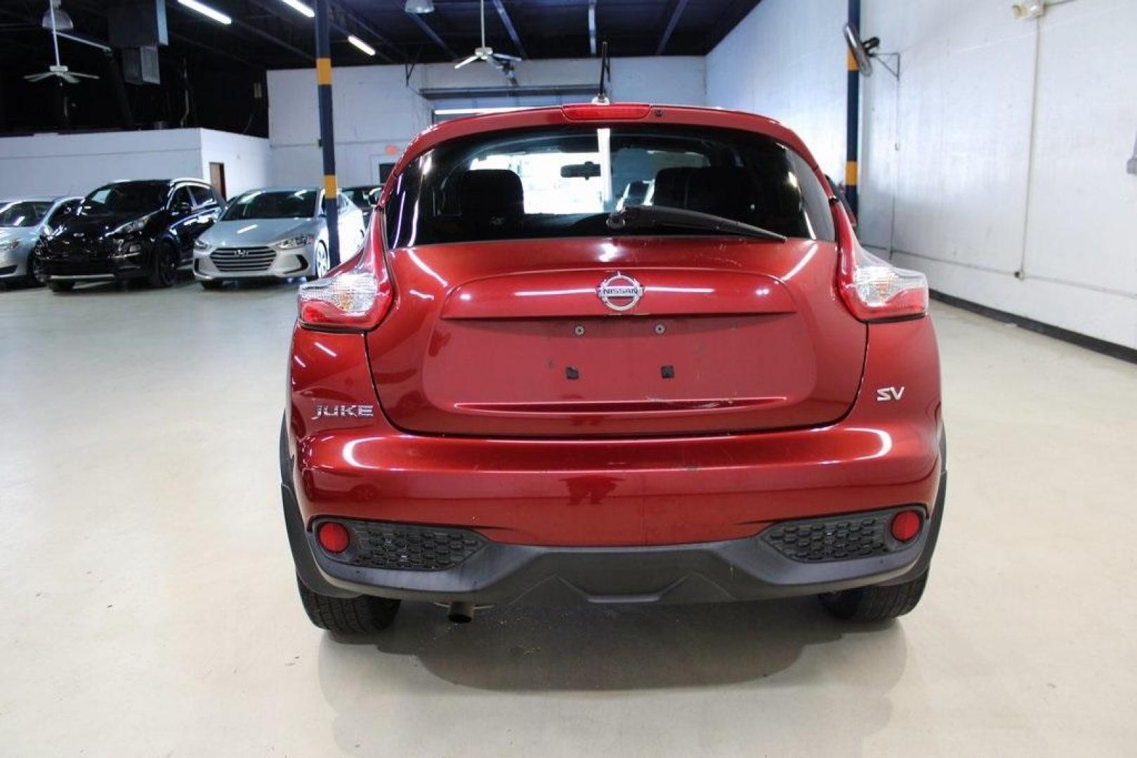 2015 Cayenne Red Pearl /Black/Red Nissan Juke SV (JN8AF5MR4FT) with an 1.6L I4 DOHC 16V engine, CVT transmission, located at 15300 Midway Rd., Addison, TX, 75001, (972) 702-0011, 32.958321, -96.838074 - HOME OF THE NO HAGGLE PRICE - WHOLESALE PRICES TO THE PUBLIC!! Juke SV, 4D Sport Utility, 1.6L I4 DOHC 16V, CVT with Xtronic, FWD, Cayenne Red Pearl, Black/Red Cloth.<br><br>Cayenne Red Pearl 2015 Nissan Juke SV<br><br>Recent Arrival! 28/32 City/Highway MPG<br><br><br>At Midway Auto Group, we strive - Photo#7