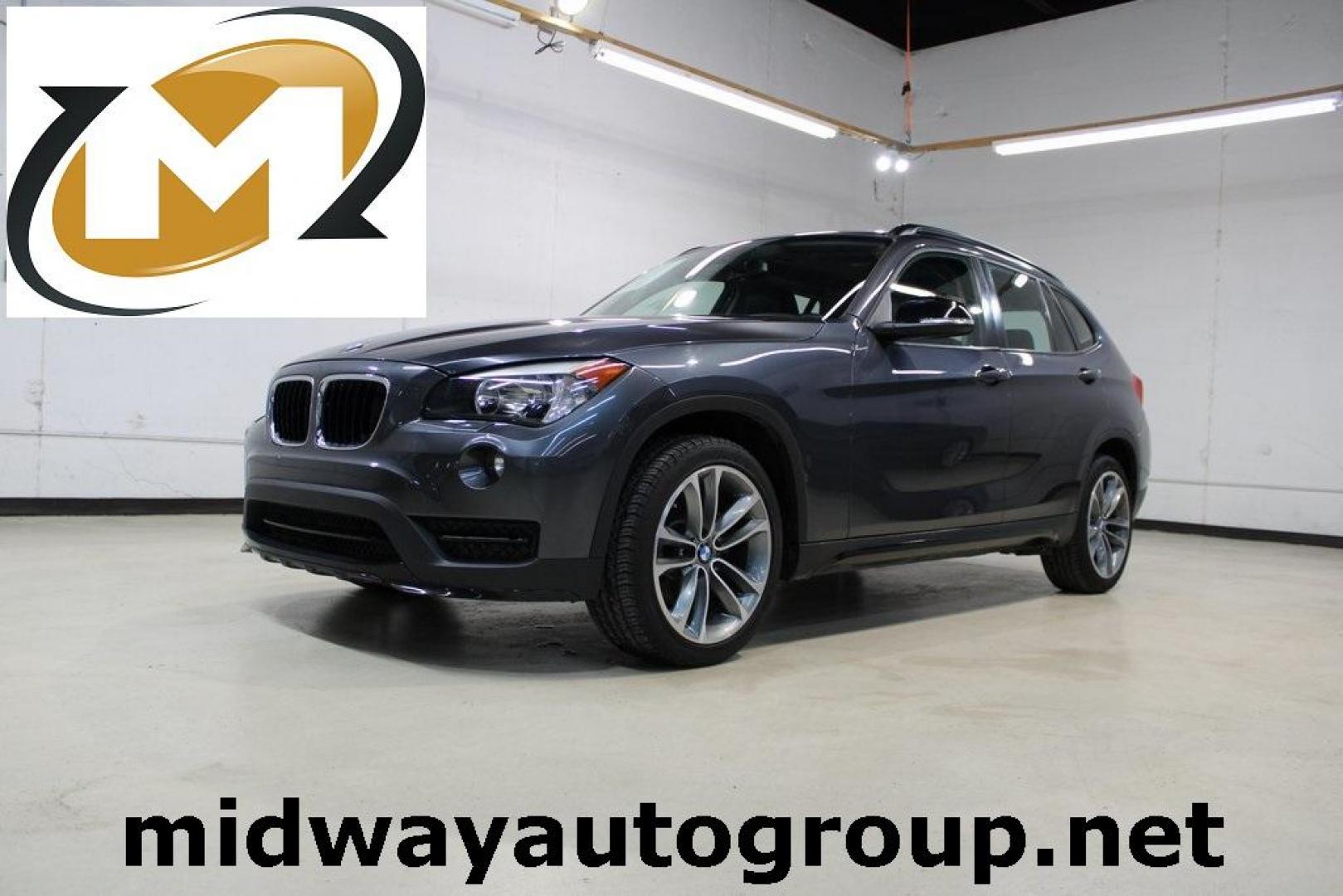 2015 Mineral Grey Metallic /Black BMW X1 xDrive28i (WBAVL1C56FV) with an 2.0L 4-Cylinder DOHC 16V TwinPower Turbo engine, Automatic transmission, located at 15300 Midway Rd., Addison, TX, 75001, (972) 702-0011, 32.958321, -96.838074 - Photo#0