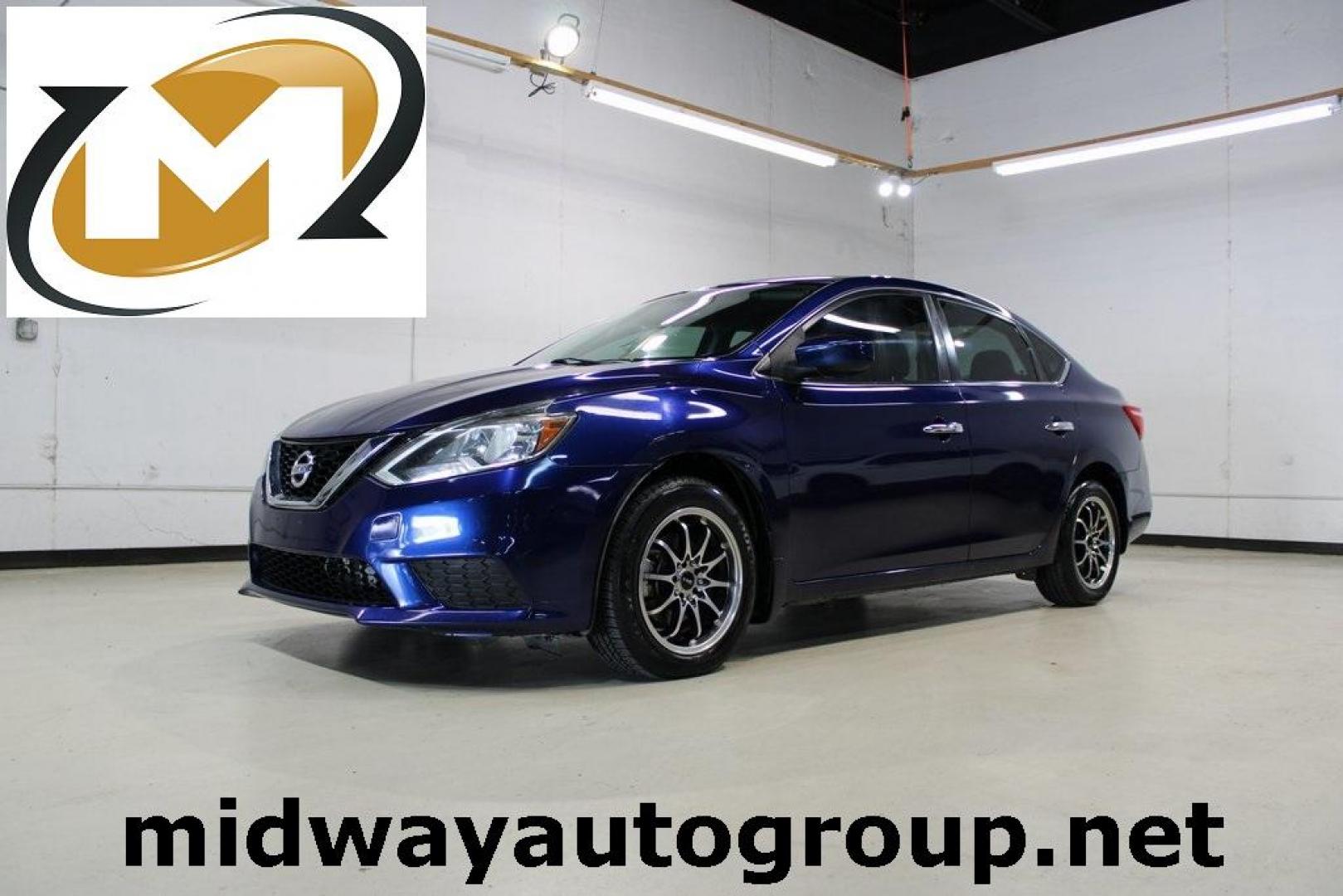 2017 Deep Blue Pearl /Charcoal Nissan Sentra SV (3N1AB7APXHL) with an 1.8L 4-Cylinder DOHC 16V engine, CVT transmission, located at 15300 Midway Rd., Addison, TX, 75001, (972) 702-0011, 32.958321, -96.838074 - HOME OF THE NO HAGGLE PRICE - WHOLESALE PRICES TO THE PUBLIC!! Sentra SV, 4D Sedan, 1.8L 4-Cylinder DOHC 16V, CVT with Xtronic, FWD, Deep Blue Pearl, Charcoal Cloth.<br><br>Deep Blue Pearl 2017 Nissan Sentra SV<br><br>29/37 City/Highway MPG<br><br><br>At Midway Auto Group, we strive to provide you w - Photo#0