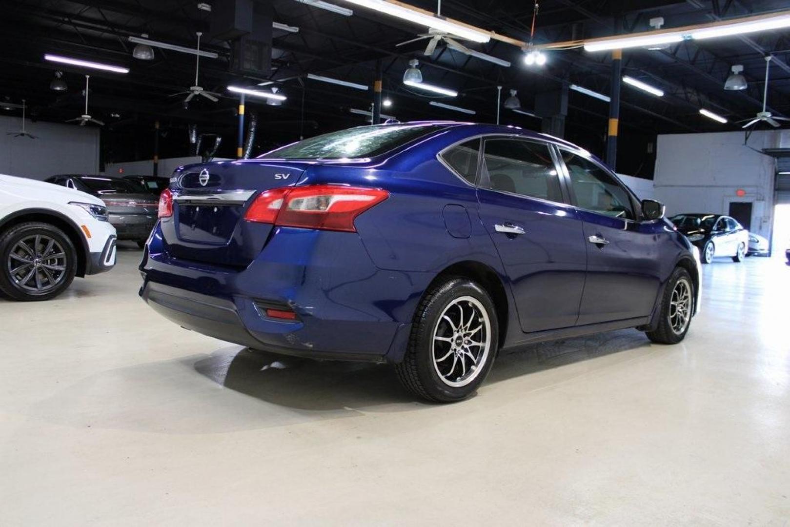 2017 Deep Blue Pearl /Charcoal Nissan Sentra SV (3N1AB7APXHL) with an 1.8L 4-Cylinder DOHC 16V engine, CVT transmission, located at 15300 Midway Rd., Addison, TX, 75001, (972) 702-0011, 32.958321, -96.838074 - HOME OF THE NO HAGGLE PRICE - WHOLESALE PRICES TO THE PUBLIC!! Sentra SV, 4D Sedan, 1.8L 4-Cylinder DOHC 16V, CVT with Xtronic, FWD, Deep Blue Pearl, Charcoal Cloth.<br><br>Deep Blue Pearl 2017 Nissan Sentra SV<br><br>29/37 City/Highway MPG<br><br><br>At Midway Auto Group, we strive to provide you w - Photo#2