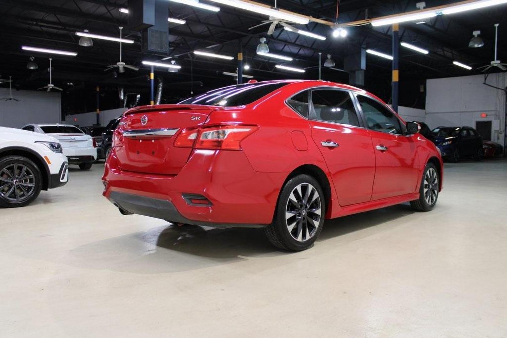 2019 Red Alert /Charcoal Nissan Sentra SR (3N1AB7AP1KY) with an 1.8L 4-Cylinder DOHC 16V engine, CVT transmission, located at 15300 Midway Rd., Addison, TX, 75001, (972) 702-0011, 32.958321, -96.838074 - HOME OF THE NO HAGGLE PRICE - WHOLESALE PRICES TO THE PUBLIC!! Sentra SR, 4D Sedan, 1.8L 4-Cylinder DOHC 16V, CVT with Xtronic, FWD, Red Alert, Charcoal Cloth.<br><br>Red Alert 2019 Nissan Sentra SR<br><br>29/37 City/Highway MPG<br><br><br>At Midway Auto Group, we strive to provide you with the best - Photo#2