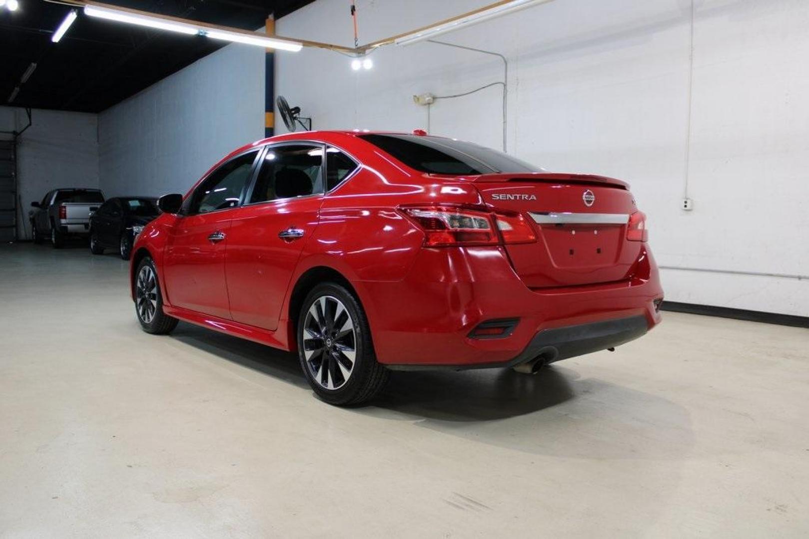 2019 Red Alert /Charcoal Nissan Sentra SR (3N1AB7AP1KY) with an 1.8L 4-Cylinder DOHC 16V engine, CVT transmission, located at 15300 Midway Rd., Addison, TX, 75001, (972) 702-0011, 32.958321, -96.838074 - HOME OF THE NO HAGGLE PRICE - WHOLESALE PRICES TO THE PUBLIC!! Sentra SR, 4D Sedan, 1.8L 4-Cylinder DOHC 16V, CVT with Xtronic, FWD, Red Alert, Charcoal Cloth.<br><br>Red Alert 2019 Nissan Sentra SR<br><br>29/37 City/Highway MPG<br><br><br>At Midway Auto Group, we strive to provide you with the best - Photo#3