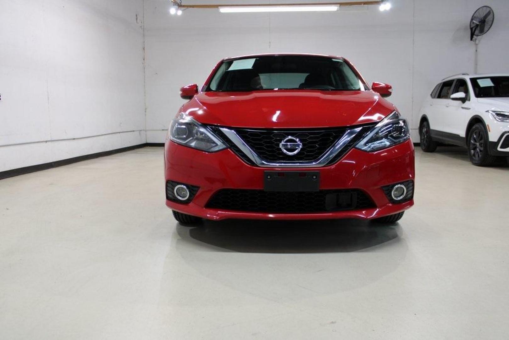 2019 Red Alert /Charcoal Nissan Sentra SR (3N1AB7AP1KY) with an 1.8L 4-Cylinder DOHC 16V engine, CVT transmission, located at 15300 Midway Rd., Addison, TX, 75001, (972) 702-0011, 32.958321, -96.838074 - HOME OF THE NO HAGGLE PRICE - WHOLESALE PRICES TO THE PUBLIC!! Sentra SR, 4D Sedan, 1.8L 4-Cylinder DOHC 16V, CVT with Xtronic, FWD, Red Alert, Charcoal Cloth.<br><br>Red Alert 2019 Nissan Sentra SR<br><br>29/37 City/Highway MPG<br><br><br>At Midway Auto Group, we strive to provide you with the best - Photo#5