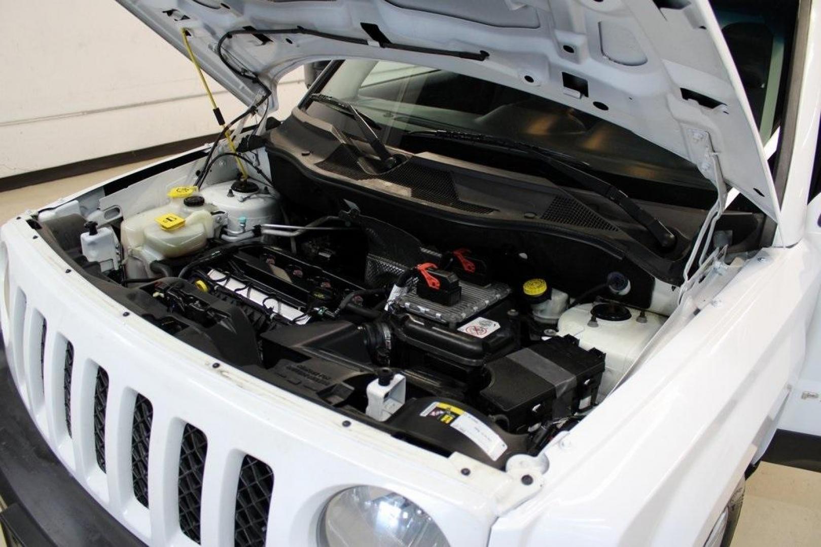 2017 Bright White Clearcoat /Dark Slate Gray Jeep Patriot Latitude (1C4NJPFA0HD) with an 2.0L I4 DOHC 16V Dual VVT engine, CVT transmission, located at 15300 Midway Rd., Addison, TX, 75001, (972) 702-0011, 32.958321, -96.838074 - Photo#27