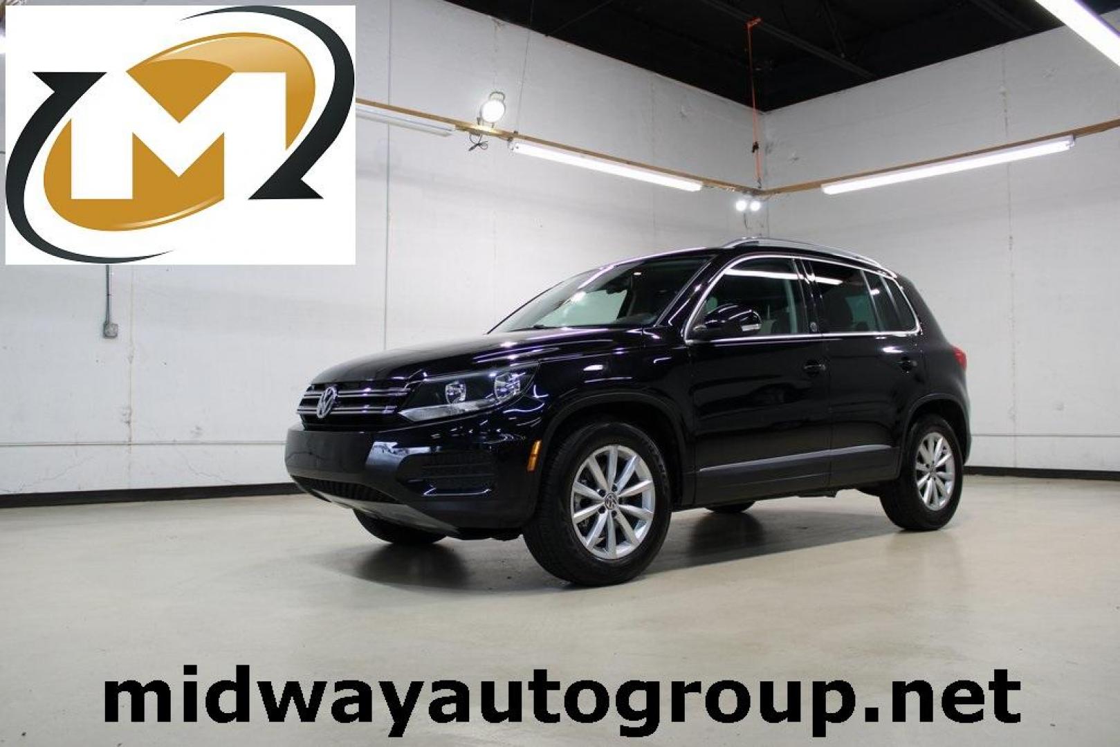 2017 Deep Black Pearl Volkswagen Tiguan 2.0T Wolfsburg Edition (WVGRV7AX9HW) with an 2.0L TSI DOHC engine, Automatic transmission, located at 15300 Midway Rd., Addison, TX, 75001, (972) 702-0011, 32.958321, -96.838074 - Photo#0