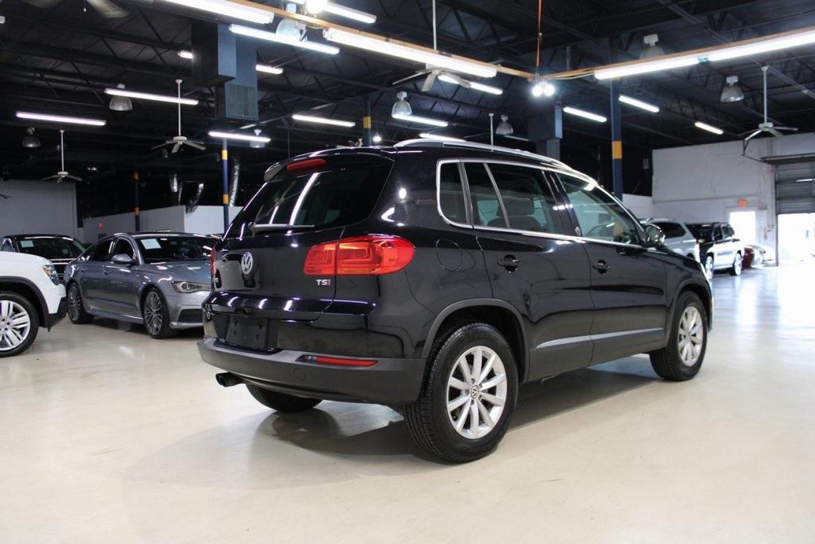 2017 Deep Black Pearl Volkswagen Tiguan 2.0T Wolfsburg Edition (WVGRV7AX9HW) with an 2.0L TSI DOHC engine, Automatic transmission, located at 15300 Midway Rd., Addison, TX, 75001, (972) 702-0011, 32.958321, -96.838074 - Photo#2