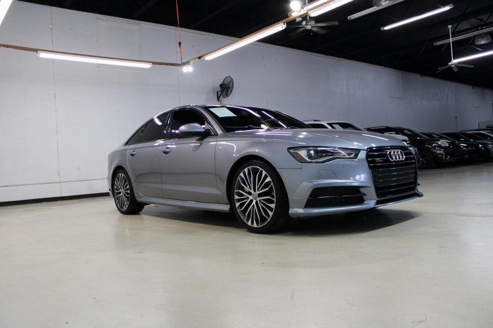 2016 Florett Silver Metallic Audi A6 2.0T Premium (WAUFFAFC0GN) with an 2.0L 4-Cylinder TFSI engine, Automatic transmission, located at 15300 Midway Rd., Addison, TX, 75001, (972) 702-0011, 32.958321, -96.838074 - Photo#6