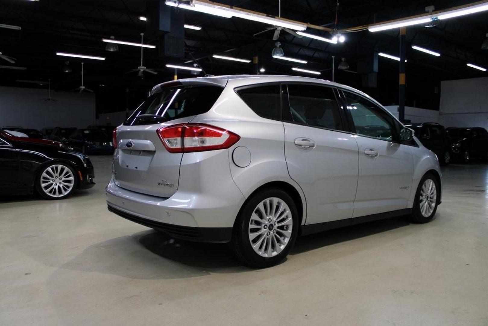 2018 Ingot Silver /Charcoal Black Ford C-Max Hybrid SE (1FADP5AU1JL) with an I4 Hybrid engine, CVT transmission, located at 15300 Midway Rd., Addison, TX, 75001, (972) 702-0011, 32.958321, -96.838074 - Photo#2