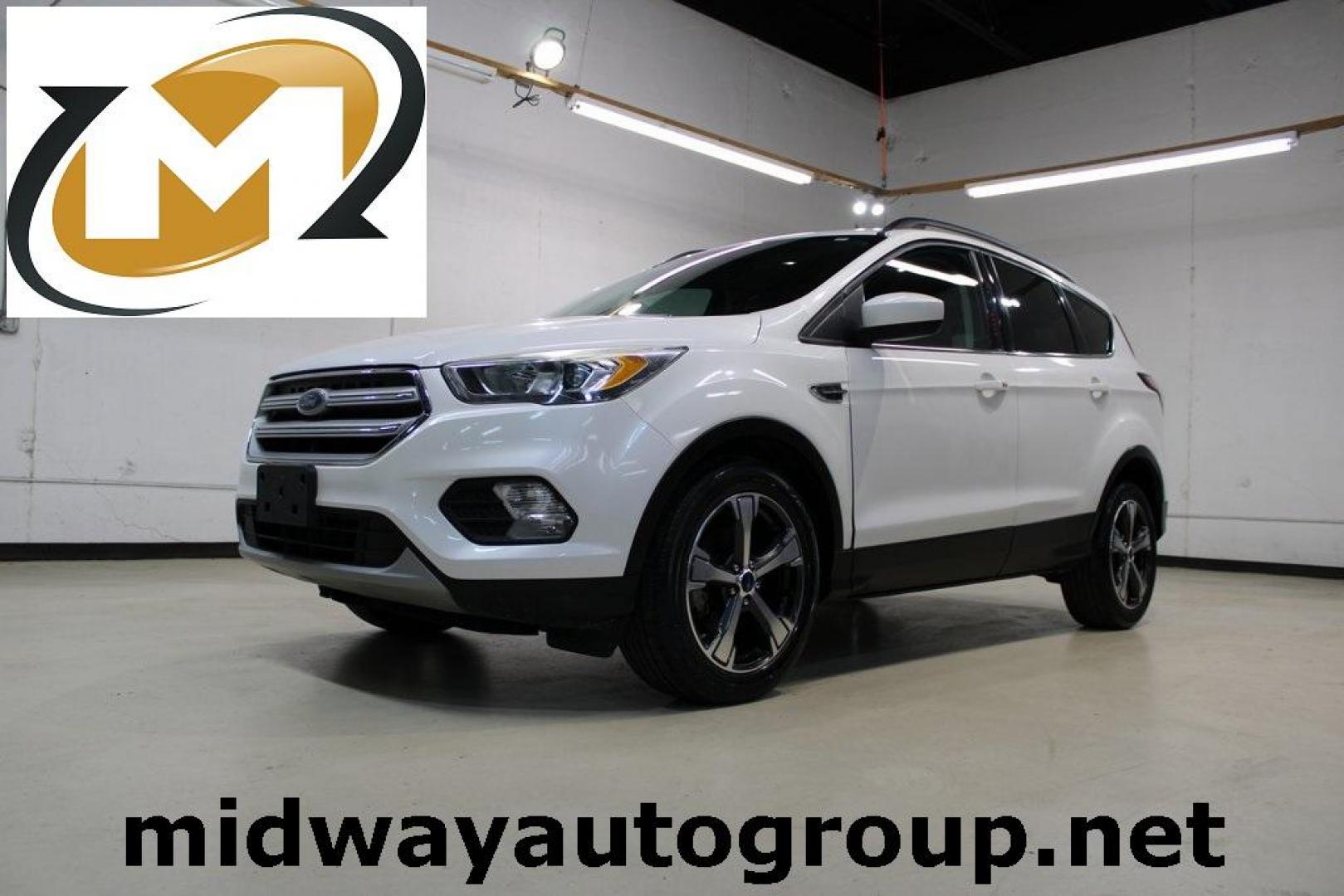 2018 White Platinum /Medium Light Stone Ford Escape SEL (1FMCU0HD2JU) with an 1.5L EcoBoost engine, Automatic transmission, located at 15300 Midway Rd., Addison, TX, 75001, (972) 702-0011, 32.958321, -96.838074 - Photo#0