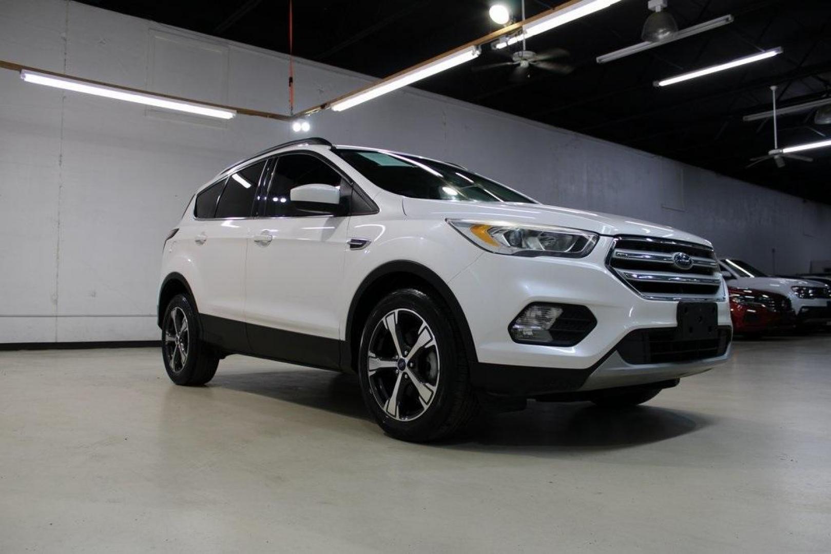 2018 White Platinum /Medium Light Stone Ford Escape SEL (1FMCU0HD2JU) with an 1.5L EcoBoost engine, Automatic transmission, located at 15300 Midway Rd., Addison, TX, 75001, (972) 702-0011, 32.958321, -96.838074 - Photo#1