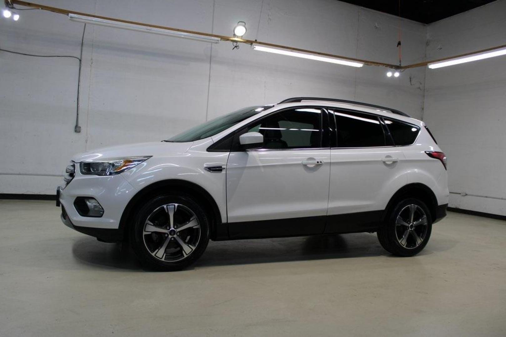 2018 White Platinum /Medium Light Stone Ford Escape SEL (1FMCU0HD2JU) with an 1.5L EcoBoost engine, Automatic transmission, located at 15300 Midway Rd., Addison, TX, 75001, (972) 702-0011, 32.958321, -96.838074 - Photo#4