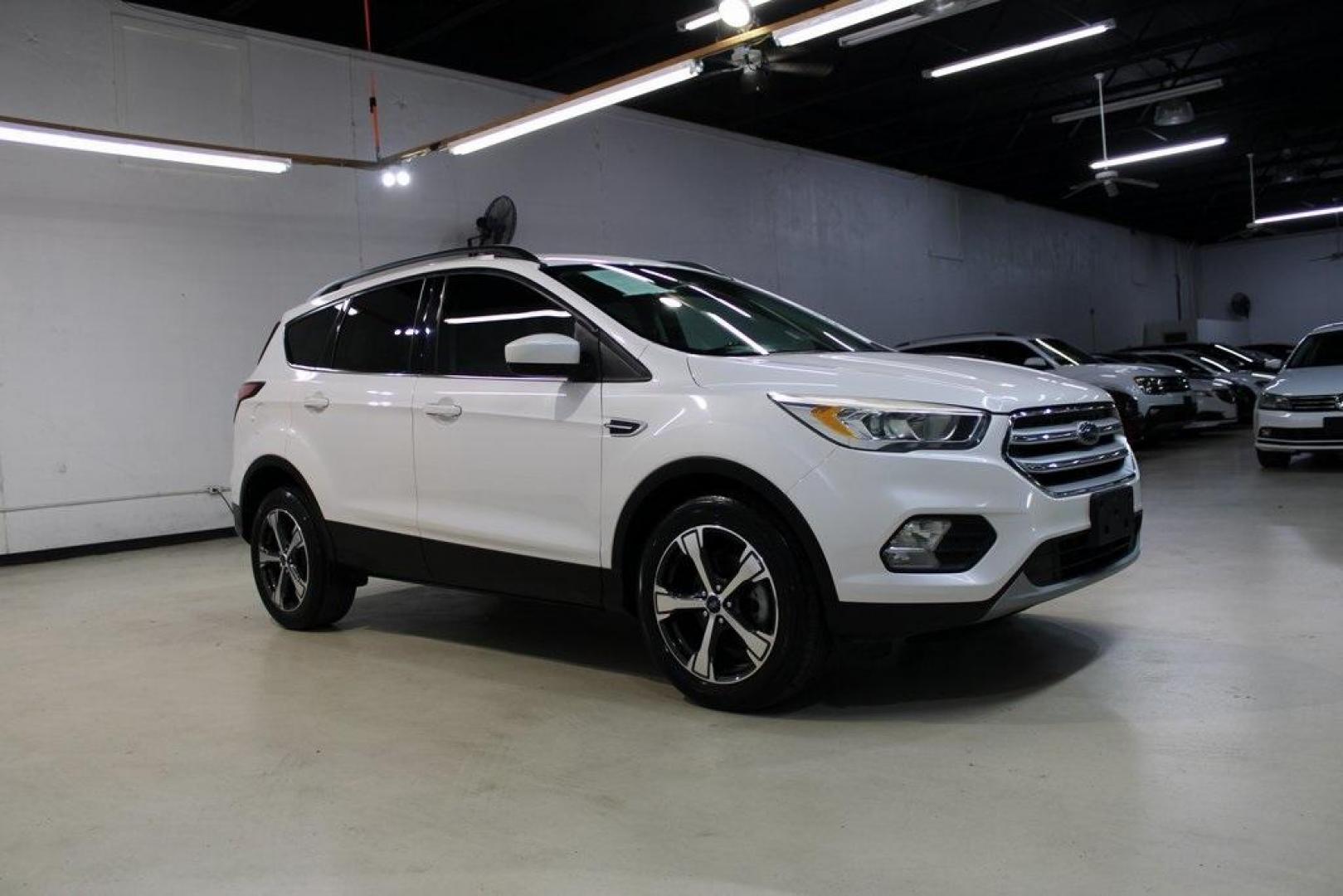 2018 White Platinum /Medium Light Stone Ford Escape SEL (1FMCU0HD2JU) with an 1.5L EcoBoost engine, Automatic transmission, located at 15300 Midway Rd., Addison, TX, 75001, (972) 702-0011, 32.958321, -96.838074 - Photo#6