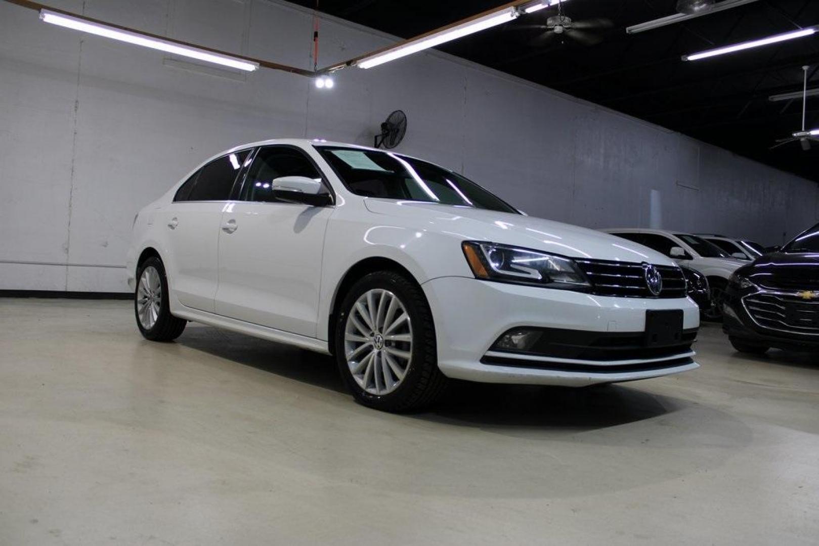 2016 Pure White /Titan Black Volkswagen Jetta 1.8T SEL (3VWL07AJXGM) with an 1.8L I4 Turbocharged engine, Automatic transmission, located at 15300 Midway Rd., Addison, TX, 75001, (972) 702-0011, 32.958321, -96.838074 - Photo#1