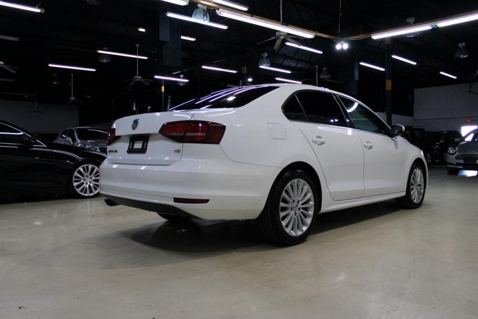 2016 Pure White /Titan Black Volkswagen Jetta 1.8T SEL (3VWL07AJXGM) with an 1.8L I4 Turbocharged engine, Automatic transmission, located at 15300 Midway Rd., Addison, TX, 75001, (972) 702-0011, 32.958321, -96.838074 - Photo#2