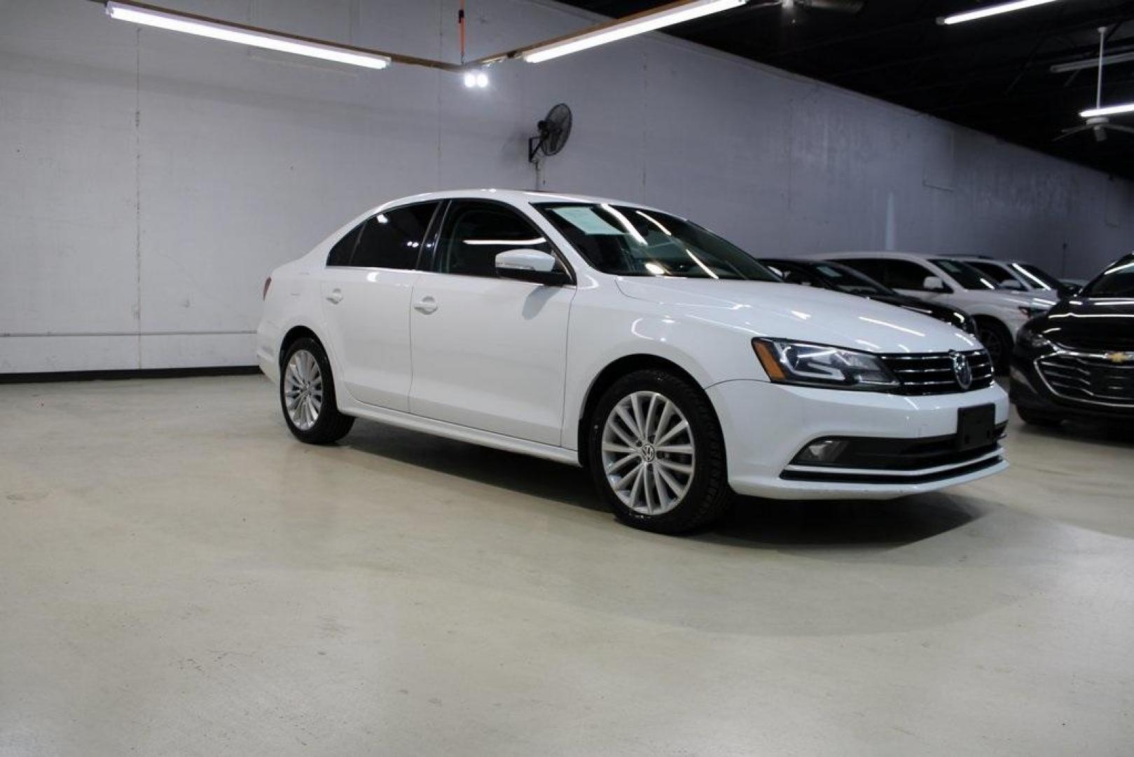 2016 Pure White /Titan Black Volkswagen Jetta 1.8T SEL (3VWL07AJXGM) with an 1.8L I4 Turbocharged engine, Automatic transmission, located at 15300 Midway Rd., Addison, TX, 75001, (972) 702-0011, 32.958321, -96.838074 - Photo#6