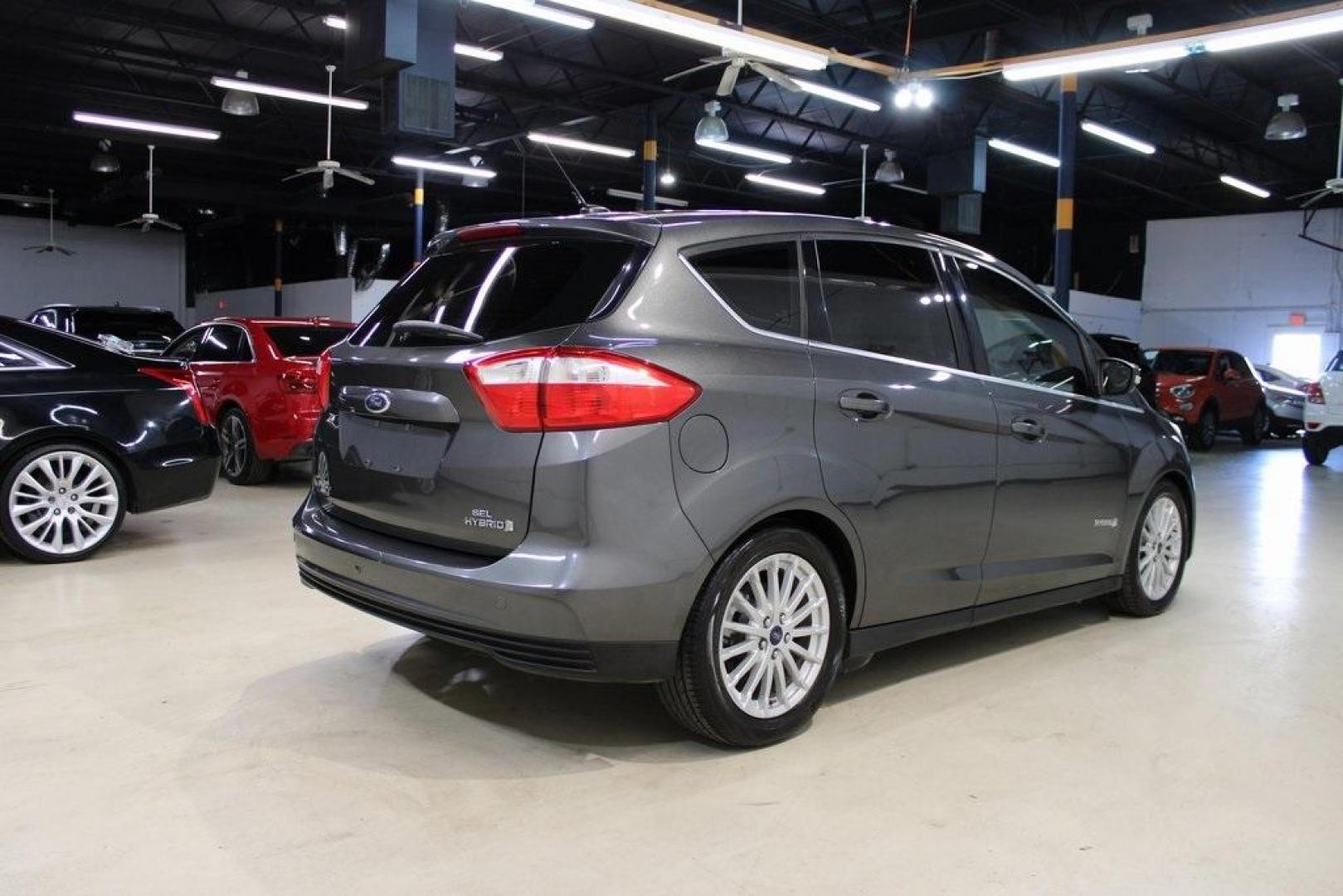 2015 Magnetic /Medium Light Stone Ford C-Max Hybrid SEL (1FADP5BU1FL) with an I4 Hybrid engine, CVT transmission, located at 15300 Midway Rd., Addison, TX, 75001, (972) 702-0011, 32.958321, -96.838074 - Photo#2