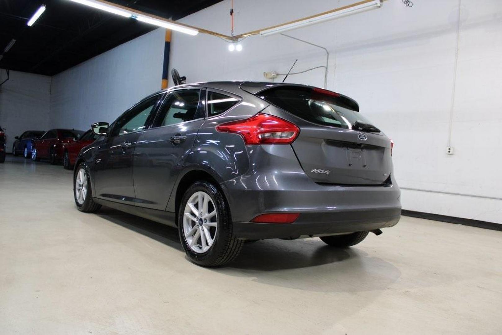 2017 Magnetic /Charcoal Black Ford Focus SE (1FADP3K21HL) with an 2.0L 4-Cylinder DGI Flex Fuel DOHC engine, Automatic transmission, located at 15300 Midway Rd., Addison, TX, 75001, (972) 702-0011, 32.958321, -96.838074 - Photo#3