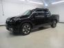 2019 Crystal Black Pearl /Black Honda Ridgeline RTL-E (5FPYK3F75KB) with an 3.5L V6 SOHC i-VTEC 24V engine, Automatic transmission, located at 15300 Midway Rd., Addison, TX, 75001, (972) 702-0011, 32.958321, -96.838074 - HOME OF THE NO HAGGLE PRICE - WHOLESALE PRICES TO THE PUBLIC!! 4WD, Bluetooth, Hands Free Connectivity, Navigation, Premium Audio, Backup Camera, Leather Seats, Sunroof / Moonroof, Ridgeline RTL-E, 4D Crew Cab, 3.5L V6 SOHC i-VTEC 24V, 6-Speed Automatic, AWD, Black, Black Leather.<br><br>Black 2019 - Photo#4