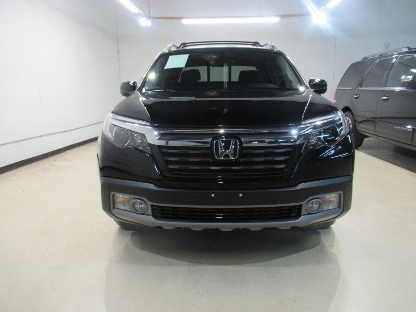 2019 Crystal Black Pearl /Black Honda Ridgeline RTL-E (5FPYK3F75KB) with an 3.5L V6 SOHC i-VTEC 24V engine, Automatic transmission, located at 15300 Midway Rd., Addison, TX, 75001, (972) 702-0011, 32.958321, -96.838074 - HOME OF THE NO HAGGLE PRICE - WHOLESALE PRICES TO THE PUBLIC!! 4WD, Bluetooth, Hands Free Connectivity, Navigation, Premium Audio, Backup Camera, Leather Seats, Sunroof / Moonroof, Ridgeline RTL-E, 4D Crew Cab, 3.5L V6 SOHC i-VTEC 24V, 6-Speed Automatic, AWD, Black, Black Leather.<br><br>Black 2019 - Photo#5