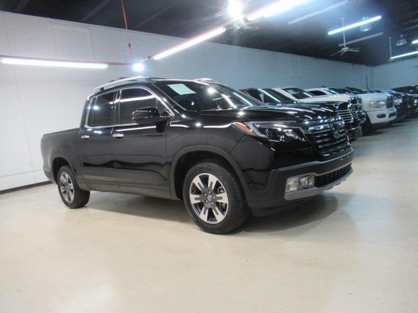 2019 Crystal Black Pearl /Black Honda Ridgeline RTL-E (5FPYK3F75KB) with an 3.5L V6 SOHC i-VTEC 24V engine, Automatic transmission, located at 15300 Midway Rd., Addison, TX, 75001, (972) 702-0011, 32.958321, -96.838074 - HOME OF THE NO HAGGLE PRICE - WHOLESALE PRICES TO THE PUBLIC!! 4WD, Bluetooth, Hands Free Connectivity, Navigation, Premium Audio, Backup Camera, Leather Seats, Sunroof / Moonroof, Ridgeline RTL-E, 4D Crew Cab, 3.5L V6 SOHC i-VTEC 24V, 6-Speed Automatic, AWD, Black, Black Leather.<br><br>Black 2019 - Photo#6