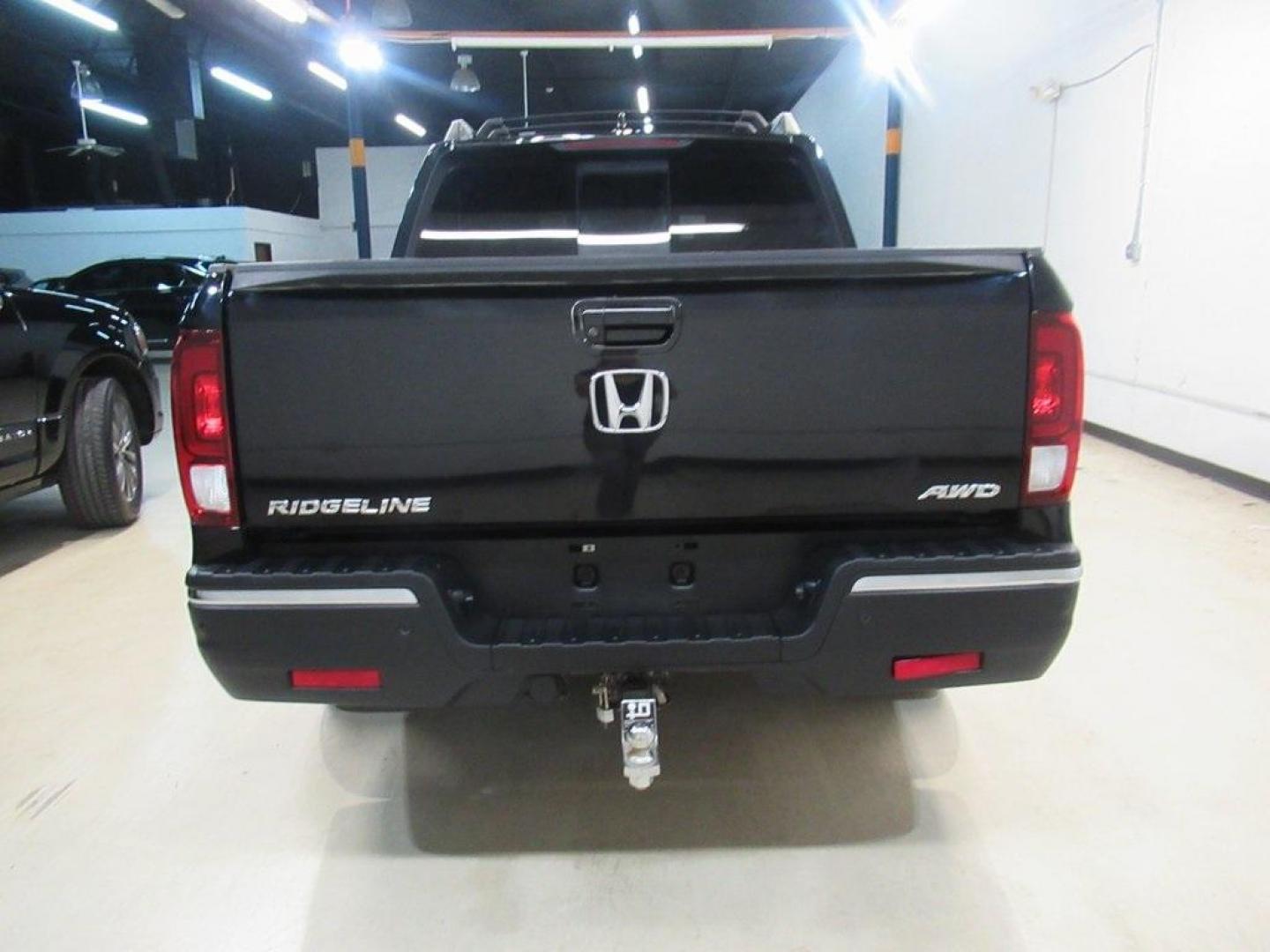 2019 Crystal Black Pearl /Black Honda Ridgeline RTL-E (5FPYK3F75KB) with an 3.5L V6 SOHC i-VTEC 24V engine, Automatic transmission, located at 15300 Midway Rd., Addison, TX, 75001, (972) 702-0011, 32.958321, -96.838074 - HOME OF THE NO HAGGLE PRICE - WHOLESALE PRICES TO THE PUBLIC!! 4WD, Bluetooth, Hands Free Connectivity, Navigation, Premium Audio, Backup Camera, Leather Seats, Sunroof / Moonroof, Ridgeline RTL-E, 4D Crew Cab, 3.5L V6 SOHC i-VTEC 24V, 6-Speed Automatic, AWD, Black, Black Leather.<br><br>Black 2019 - Photo#7