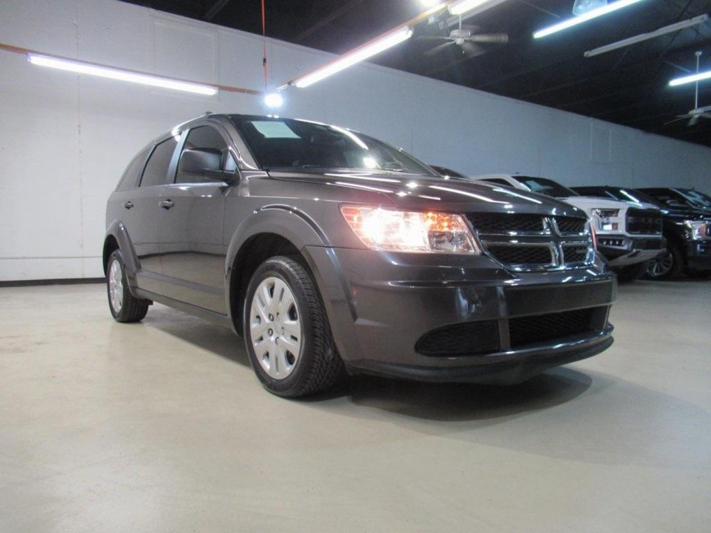 2019 Granite Crystal Metallic Clearcoat /Black Dodge Journey SE (3C4PDCAB6KT) with an 2.4L I4 DOHC 16V Dual VVT engine, Automatic transmission, located at 15300 Midway Rd., Addison, TX, 75001, (972) 702-0011, 32.958321, -96.838074 - HOME OF THE NO HAGGLE PRICE - WHOLESALE PRICES TO THE PUBLIC!! Journey SE, 4D Sport Utility, 2.4L I4 DOHC 16V Dual VVT, 4-Speed Automatic VLP, FWD, Granite Crystal Metallic Clearcoat, Black Cloth.<br><br>Granite Crystal Metallic Clearcoat 2019 Dodge Journey SE<br><br>Recent Arrival!<br><br>Awards:<b - Photo#1