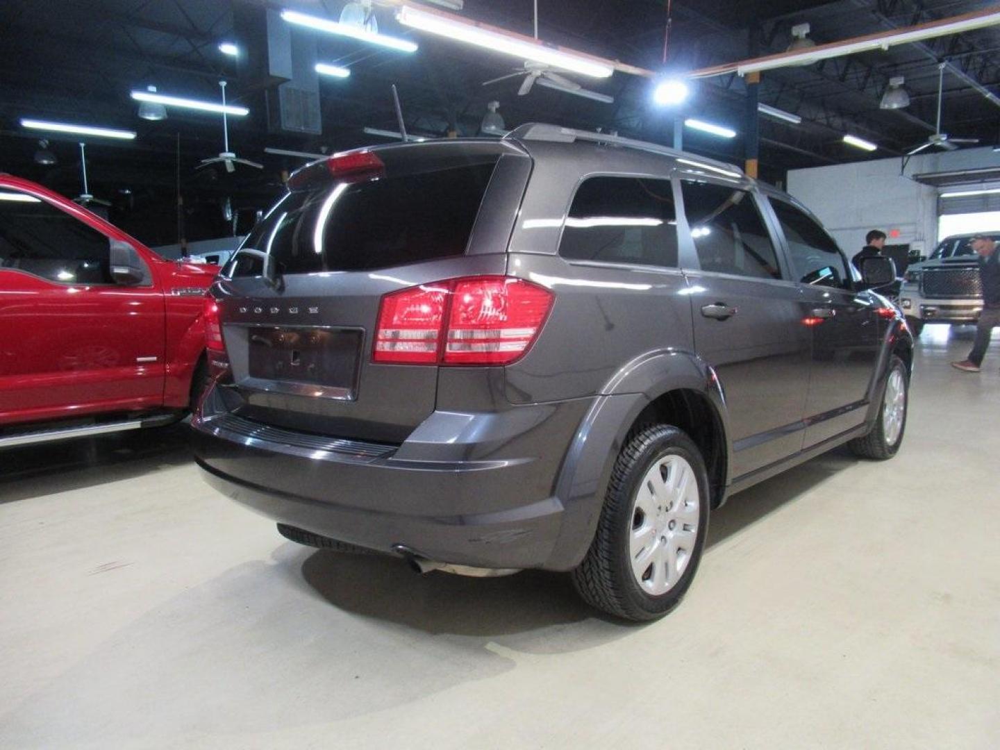 2019 Granite Crystal Metallic Clearcoat /Black Dodge Journey SE (3C4PDCAB6KT) with an 2.4L I4 DOHC 16V Dual VVT engine, Automatic transmission, located at 15300 Midway Rd., Addison, TX, 75001, (972) 702-0011, 32.958321, -96.838074 - HOME OF THE NO HAGGLE PRICE - WHOLESALE PRICES TO THE PUBLIC!! Journey SE, 4D Sport Utility, 2.4L I4 DOHC 16V Dual VVT, 4-Speed Automatic VLP, FWD, Granite Crystal Metallic Clearcoat, Black Cloth.<br><br>Granite Crystal Metallic Clearcoat 2019 Dodge Journey SE<br><br>Recent Arrival!<br><br>Awards:<b - Photo#2