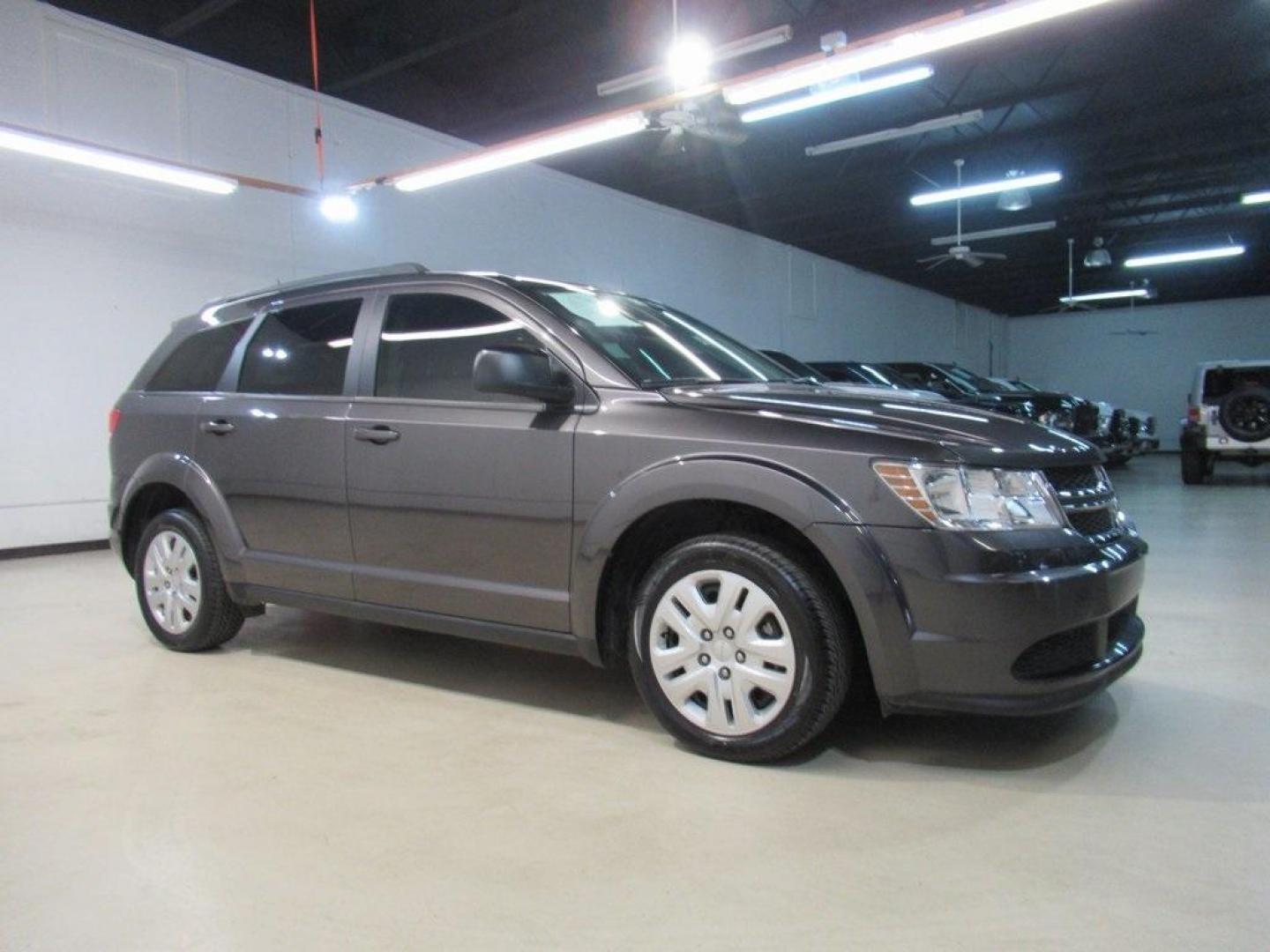 2019 Granite Crystal Metallic Clearcoat /Black Dodge Journey SE (3C4PDCAB6KT) with an 2.4L I4 DOHC 16V Dual VVT engine, Automatic transmission, located at 15300 Midway Rd., Addison, TX, 75001, (972) 702-0011, 32.958321, -96.838074 - HOME OF THE NO HAGGLE PRICE - WHOLESALE PRICES TO THE PUBLIC!! Journey SE, 4D Sport Utility, 2.4L I4 DOHC 16V Dual VVT, 4-Speed Automatic VLP, FWD, Granite Crystal Metallic Clearcoat, Black Cloth.<br><br>Granite Crystal Metallic Clearcoat 2019 Dodge Journey SE<br><br>Recent Arrival!<br><br>Awards:<b - Photo#6