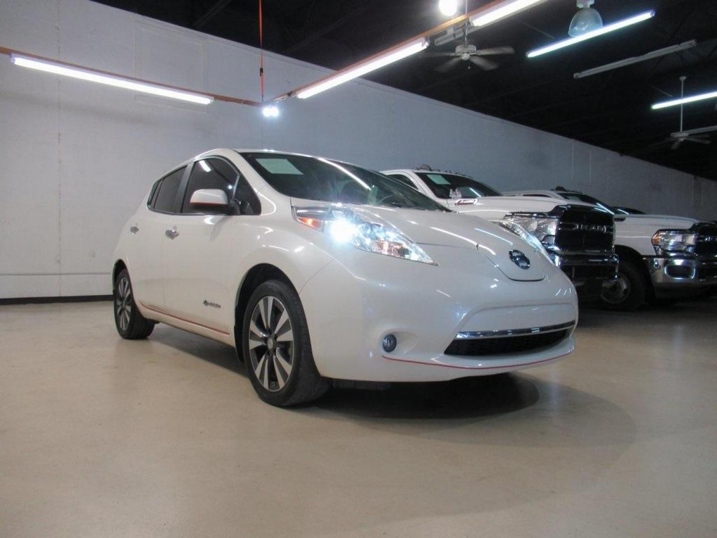 2015 Pearl White /Black Nissan Leaf SV (1N4AZ0CP7FC) with an Electric Motor engine, Automatic transmission, located at 15300 Midway Rd., Addison, TX, 75001, (972) 702-0011, 32.958321, -96.838074 - HOME OF THE NO HAGGLE PRICE - WHOLESALE PRICES TO THE PUBLIC!! Backup Camera, Leaf SV, 4D Hatchback, 80kW AC Synchronous Motor, Single Speed Reducer, FWD, Pearl White, Black Cloth.<br><br>Pearl White 2015 Nissan Leaf SV<br><br>Recent Arrival! 126/101 City/Highway MPG<br><br>Awards:<br> * 2015 KBB.c - Photo#1