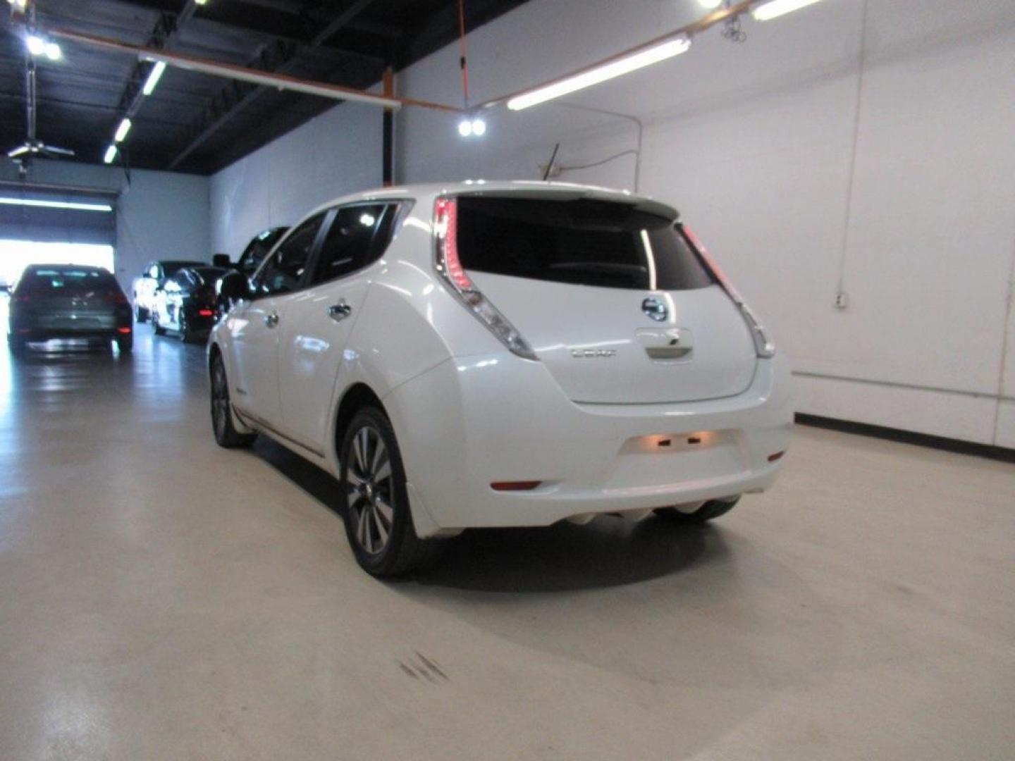 2015 Pearl White /Black Nissan Leaf SV (1N4AZ0CP7FC) with an Electric Motor engine, Automatic transmission, located at 15300 Midway Rd., Addison, TX, 75001, (972) 702-0011, 32.958321, -96.838074 - HOME OF THE NO HAGGLE PRICE - WHOLESALE PRICES TO THE PUBLIC!! Backup Camera, Leaf SV, 4D Hatchback, 80kW AC Synchronous Motor, Single Speed Reducer, FWD, Pearl White, Black Cloth.<br><br>Pearl White 2015 Nissan Leaf SV<br><br>Recent Arrival! 126/101 City/Highway MPG<br><br>Awards:<br> * 2015 KBB.c - Photo#3