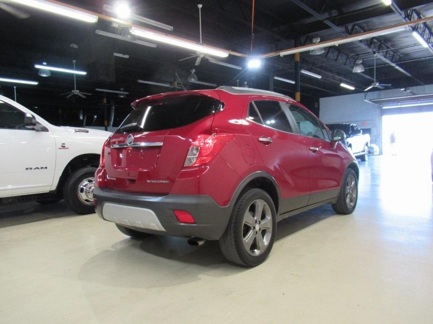 2014 Ruby Red Metallic /Ebony Buick Encore Leather (KL4CJCSBXEB) with an ECOTEC 1.4L I4 SMPI DOHC Turbocharged VVT engine, Automatic transmission, located at 15300 Midway Rd., Addison, TX, 75001, (972) 702-0011, 32.958321, -96.838074 - HOME OF THE NO HAGGLE PRICE - WHOLESALE PRICES TO THE PUBLIC!! Bluetooth, Hands Free Connectivity, Navigation, Backup Camera, Leather Seats, Sunroof / Moonroof, Encore Leather, 4D Sport Utility, ECOTEC 1.4L I4 SMPI DOHC Turbocharged VVT, 6-Speed Automatic, FWD, Ruby Red Metallic, Ebony Leather.<br>< - Photo#2